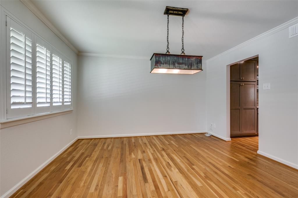6815 Santa Maria Lane Dallas, TX 75214 - Photo 9 of 24 a view of empty room with wooden floor and window