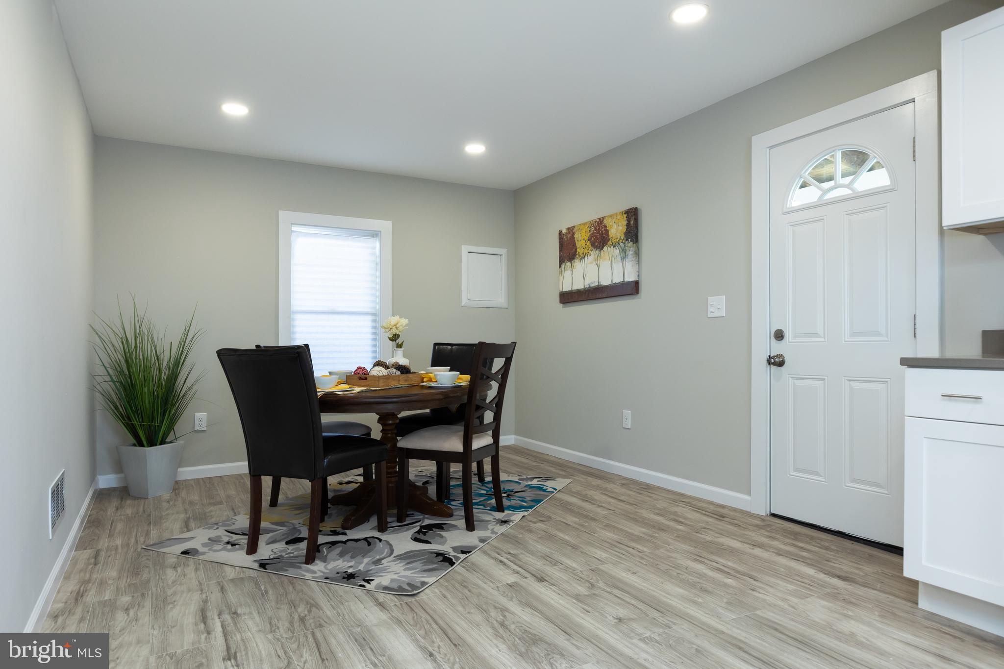 2407 Hammonds Ferry Road Halethorpe, MD 21227 - Photo 10 of 43 a view of a dining room with furniture and wooden floor