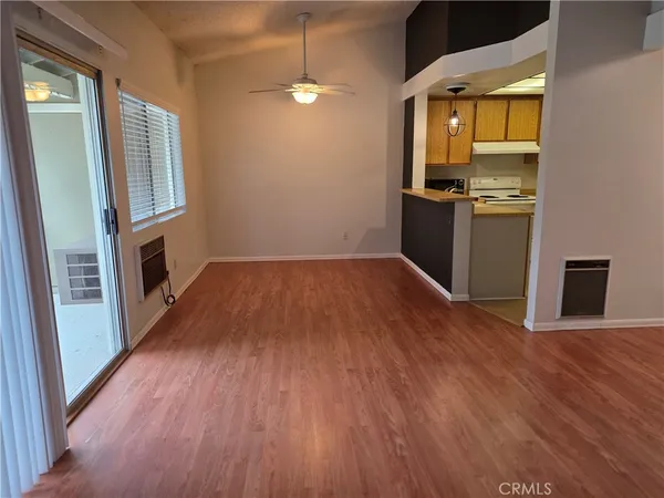 wooden floor in an empty room with a fireplace