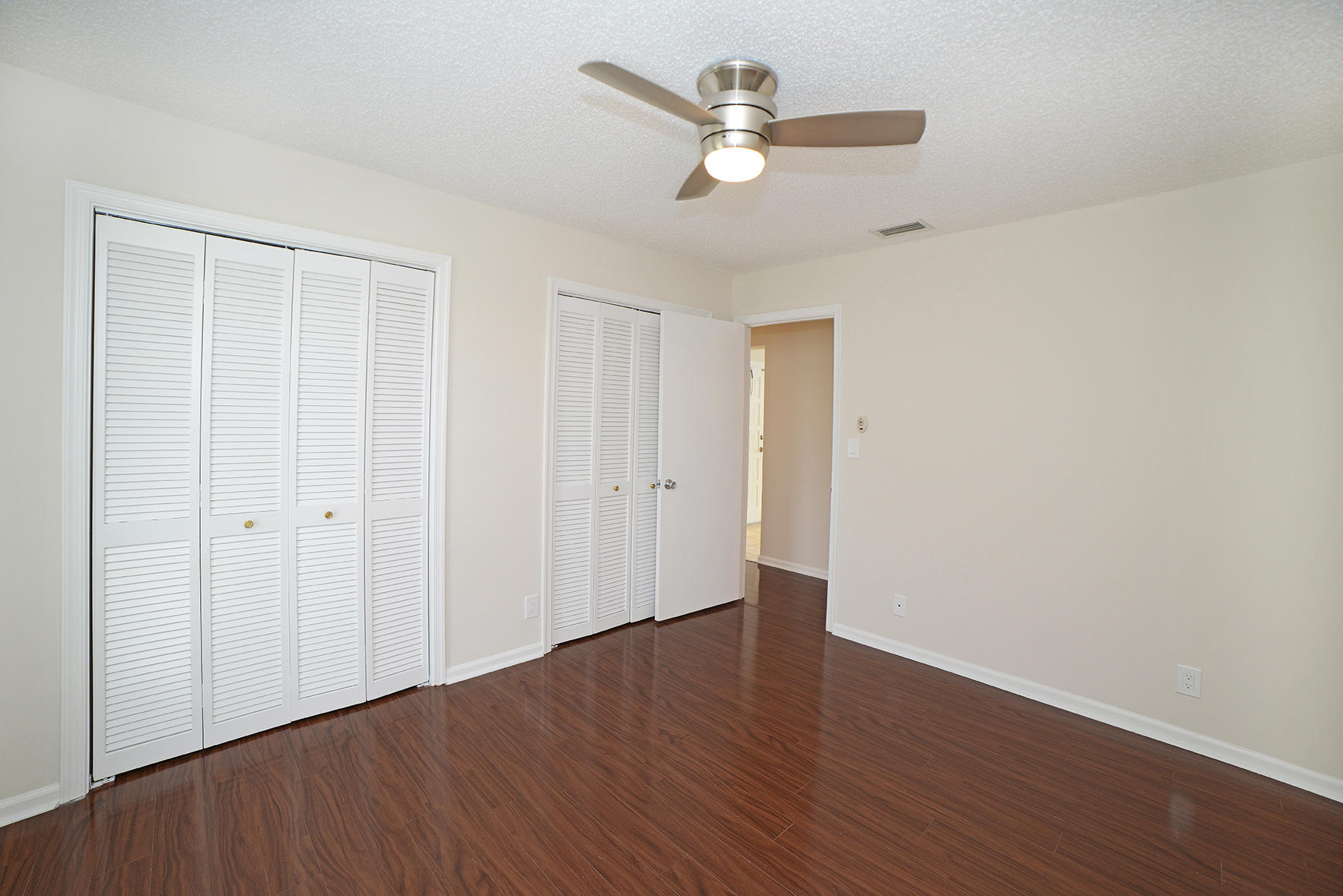 9053 Old Pine Road Boca Raton, FL 33428 - Photo 28 of 42 a view of an empty room with wooden floor