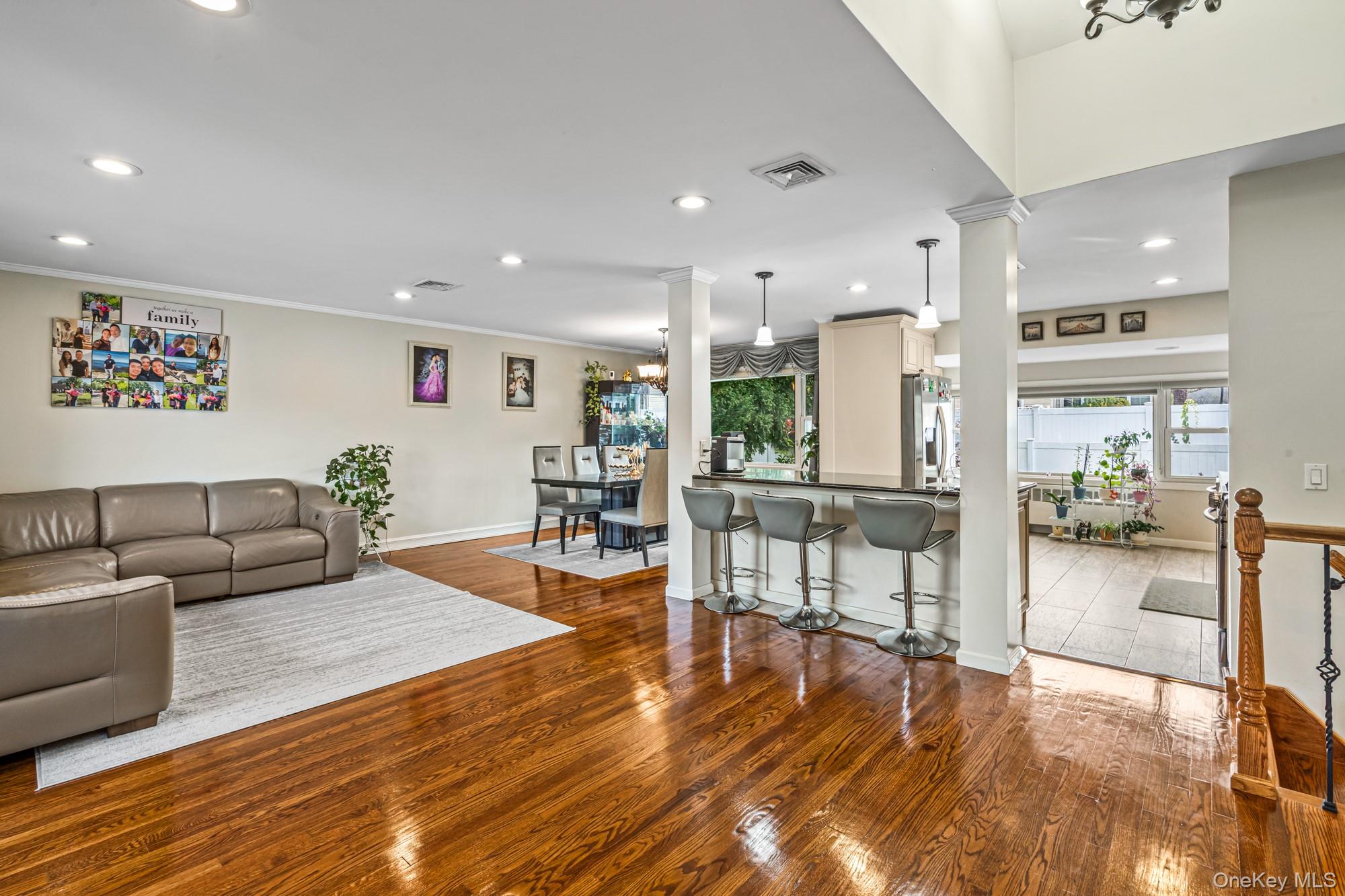 15 Vista Road Plainview, NY 11803 - Photo 4 of 26 a living room with furniture and a wooden floor