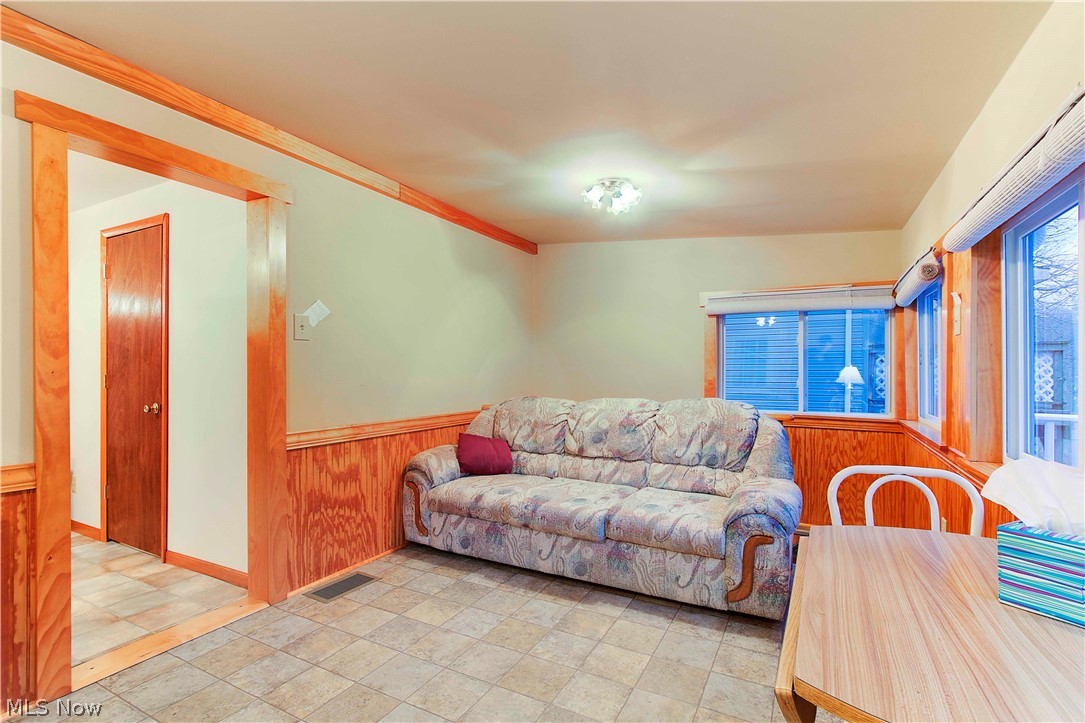 556 Bramble Road Southwest Carrollton, OH 44615 - Photo 28 of 34 Stair behind couch lead to lower level