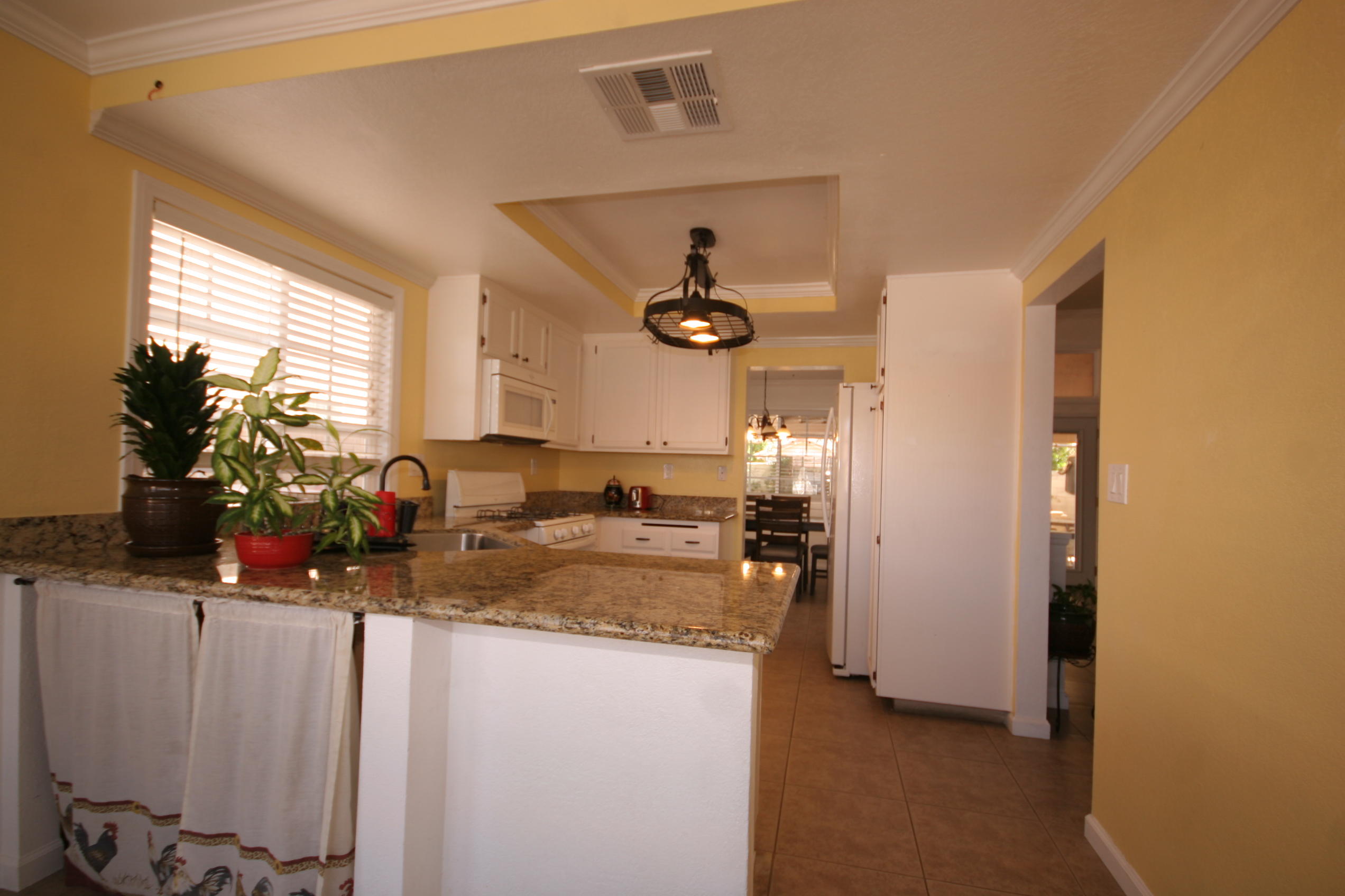 45736 Sutter Creek Road Indio, CA 92201 - Photo 16 of 44 a kitchen with sink and refrigerator