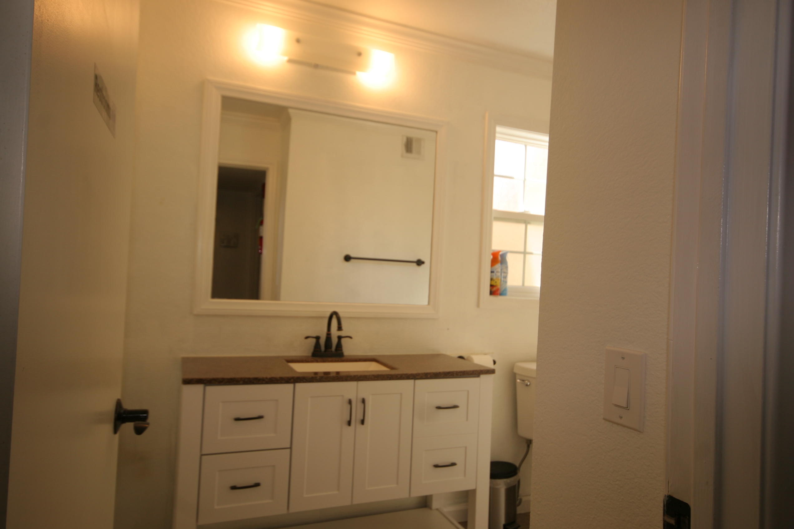 45736 Sutter Creek Road Indio, CA 92201 - Photo 21 of 44 a bathroom with a sink and a mirror