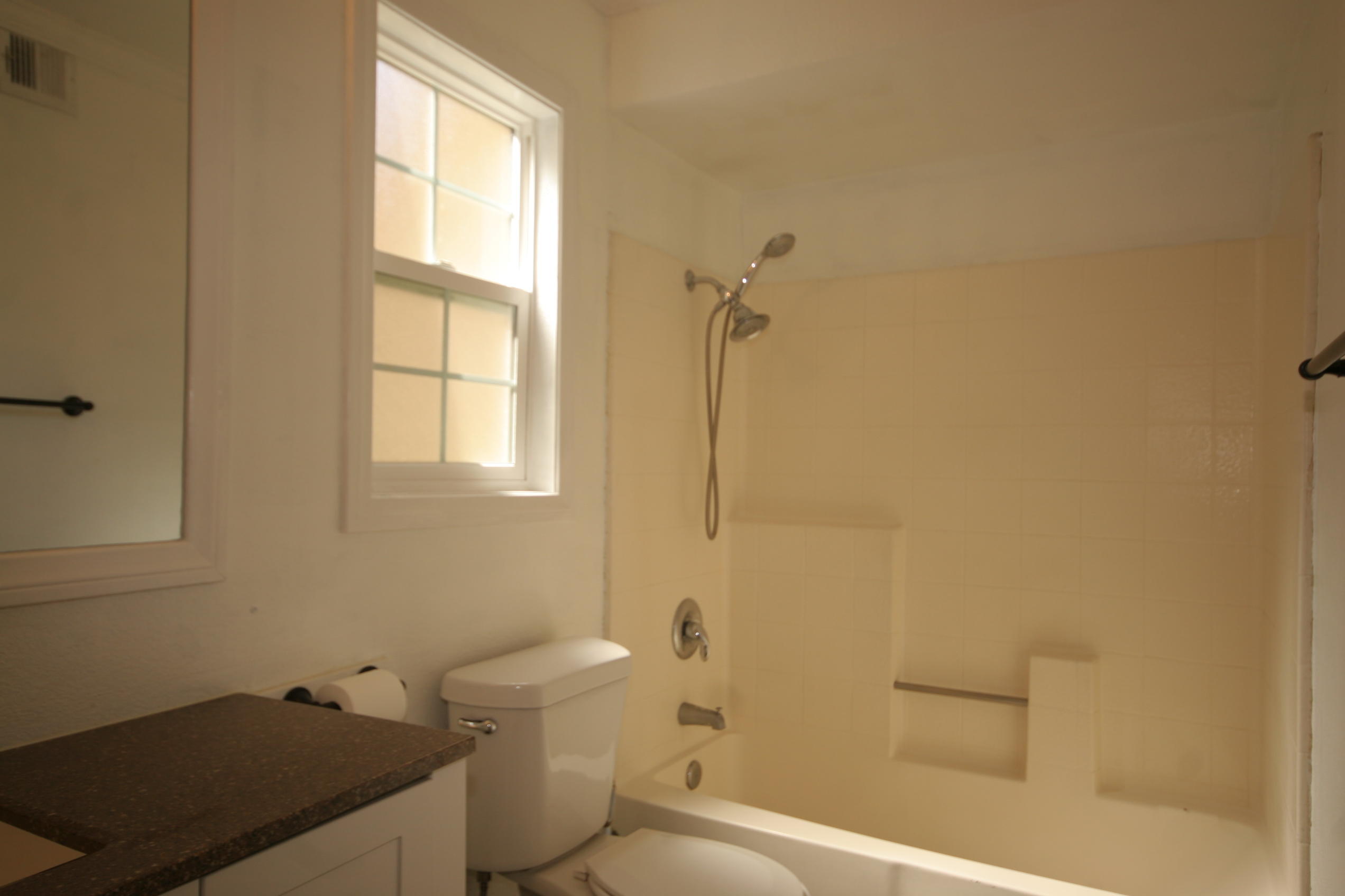 45736 Sutter Creek Road Indio, CA 92201 - Photo 22 of 44 a bathroom with a granite countertop sink a toilet and shower