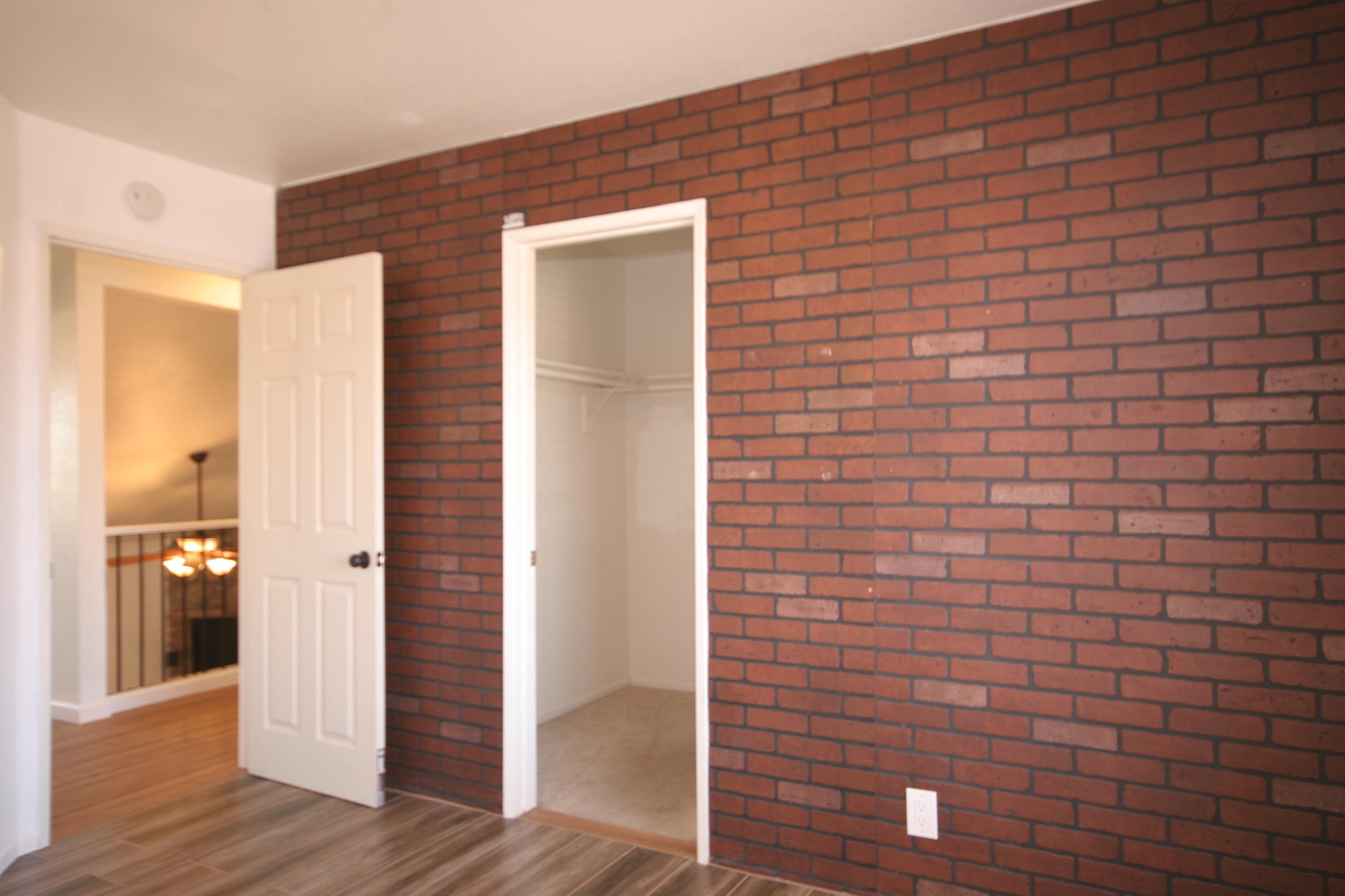 45736 Sutter Creek Road Indio, CA 92201 - Photo 26 of 44 a view of an empty room with wooden floor and a bathroom