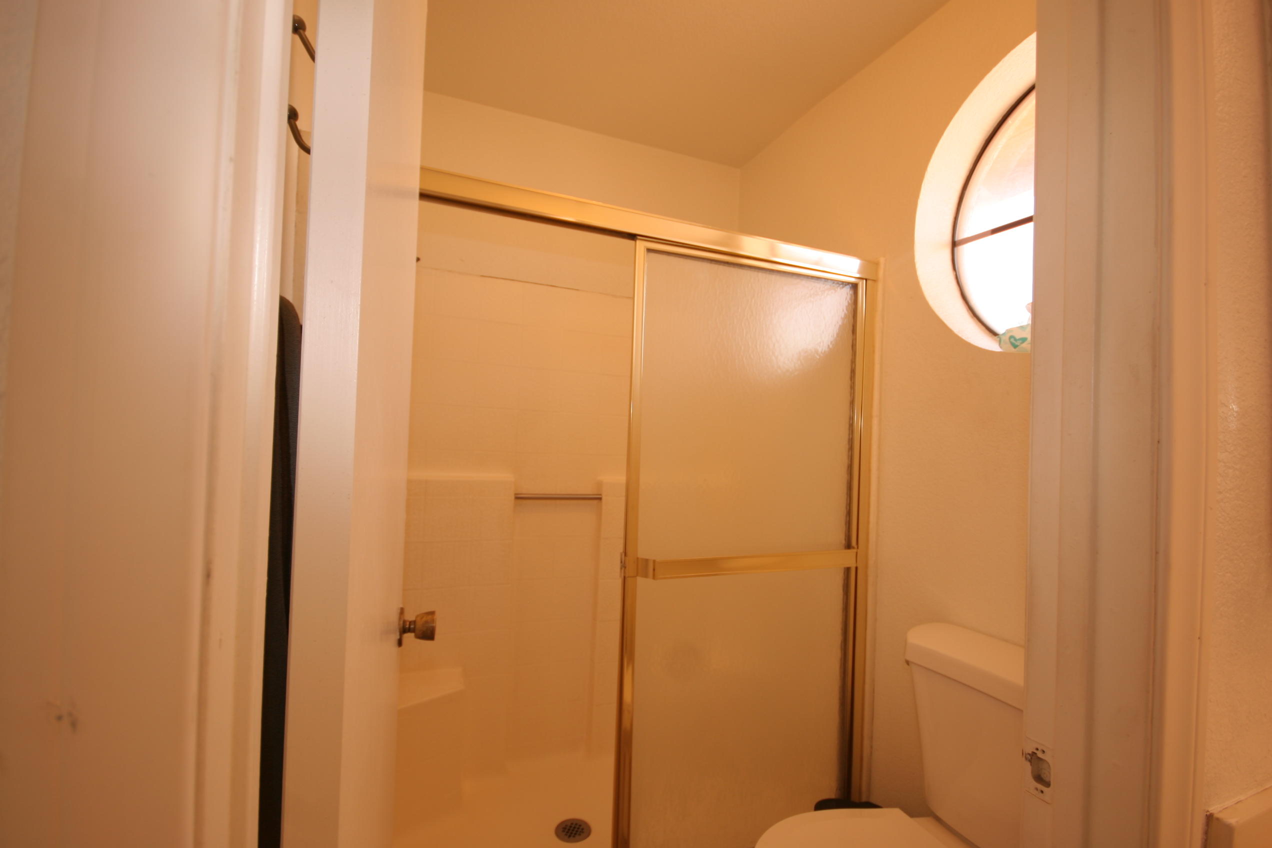 45736 Sutter Creek Road Indio, CA 92201 - Photo 36 of 44 a bathroom with a mirror and a shower