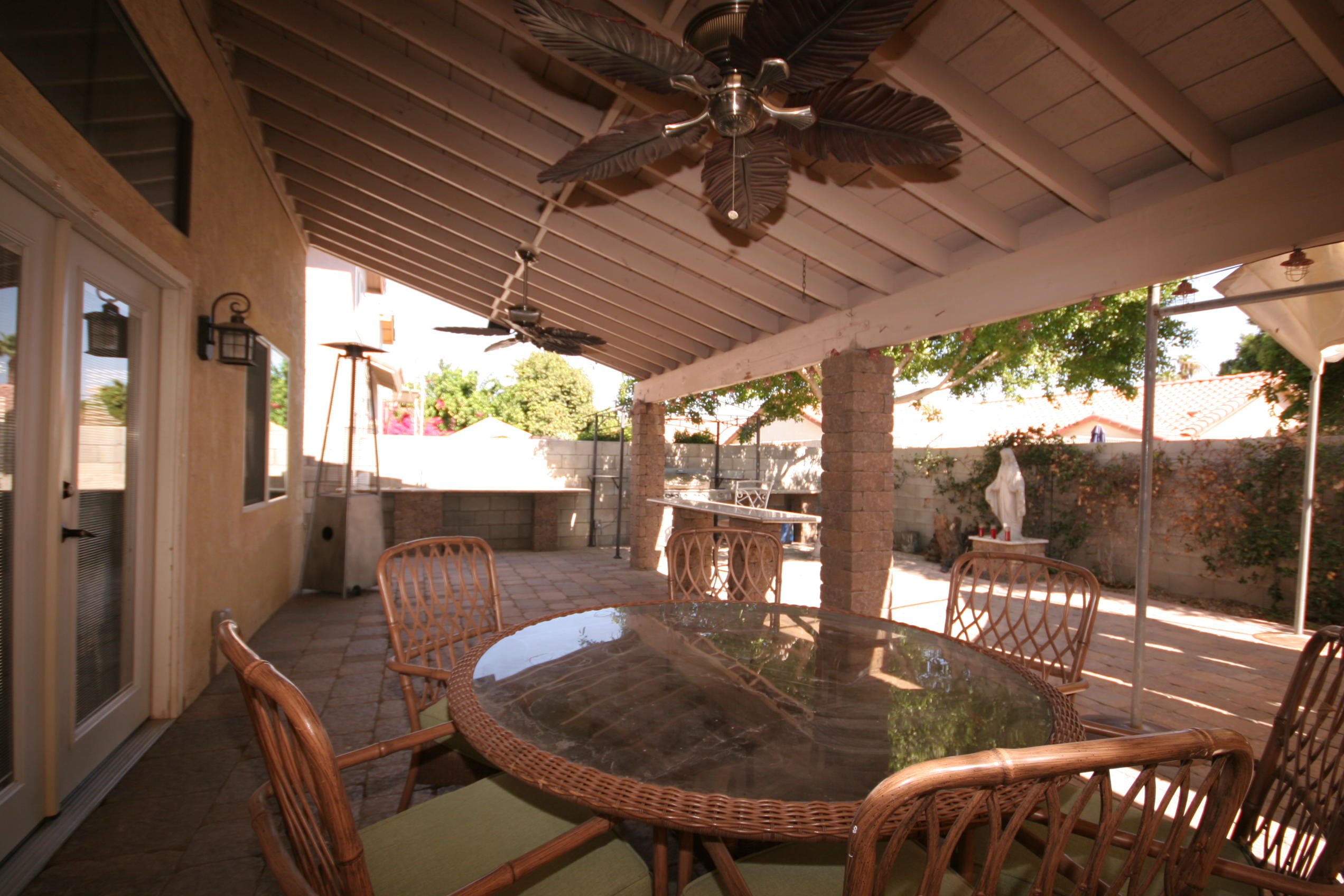 45736 Sutter Creek Road Indio, CA 92201 - Photo 39 of 44 a view of a patio with a table chairs and a table
