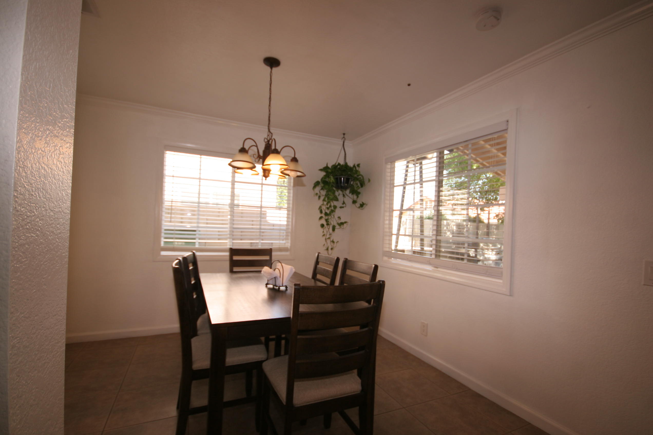 45736 Sutter Creek Road Indio, CA 92201 - Photo 9 of 44 a dining room with furniture and window
