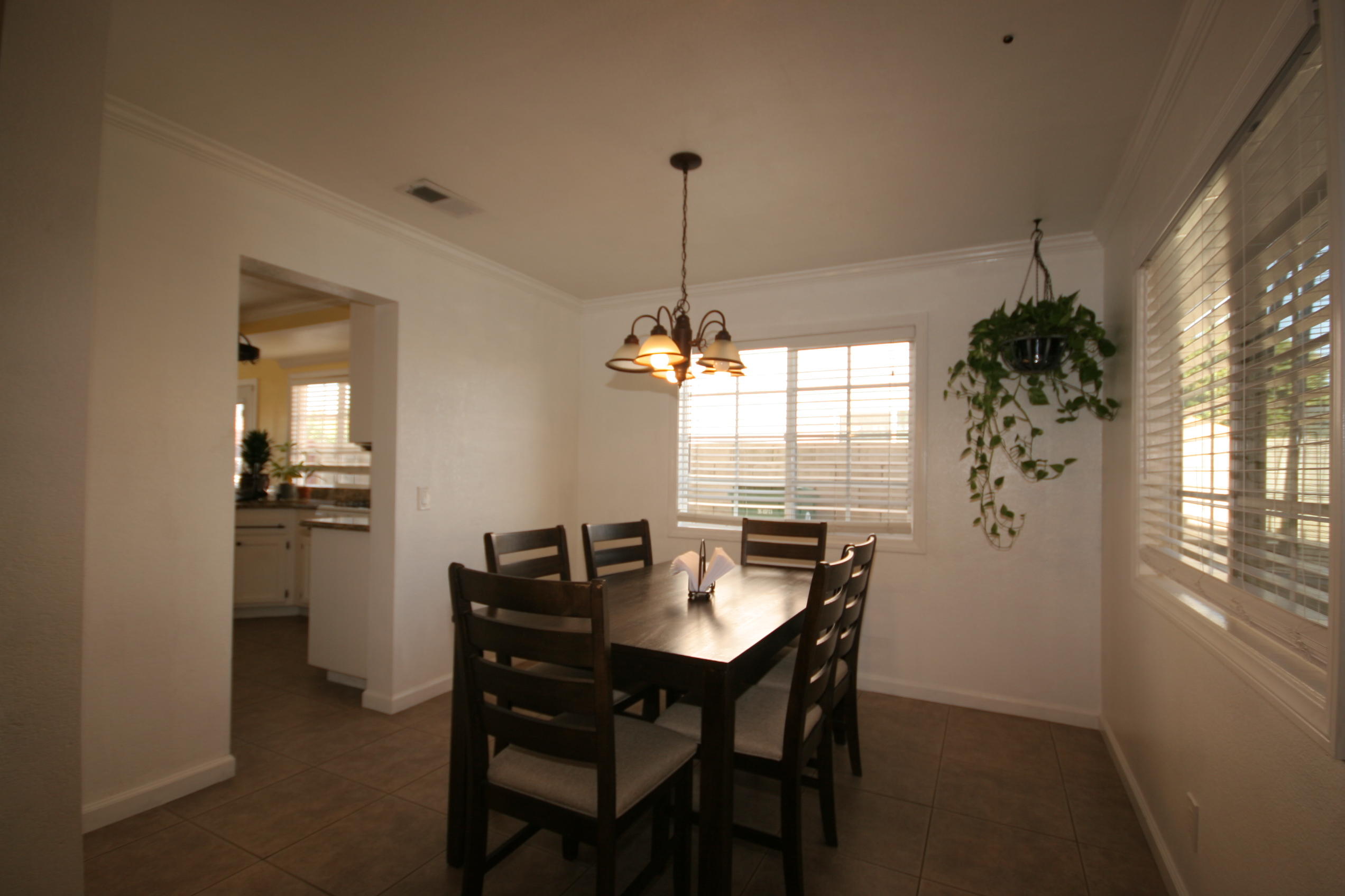 45736 Sutter Creek Road Indio, CA 92201 - Photo 10 of 44 a dining room with furniture window and wooden floor