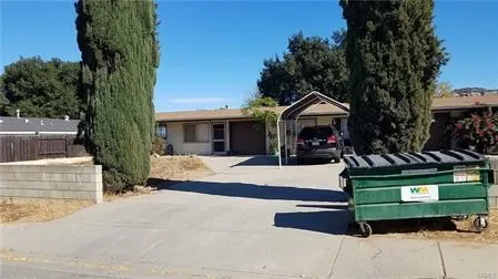 8715 Carribean Way Santee, CA 92071 - Photo 2 of 2 a front view of a house with a garden