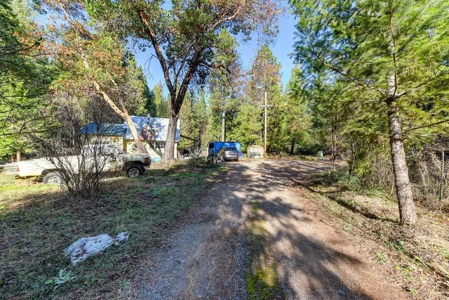 front view of a house with lots of green space