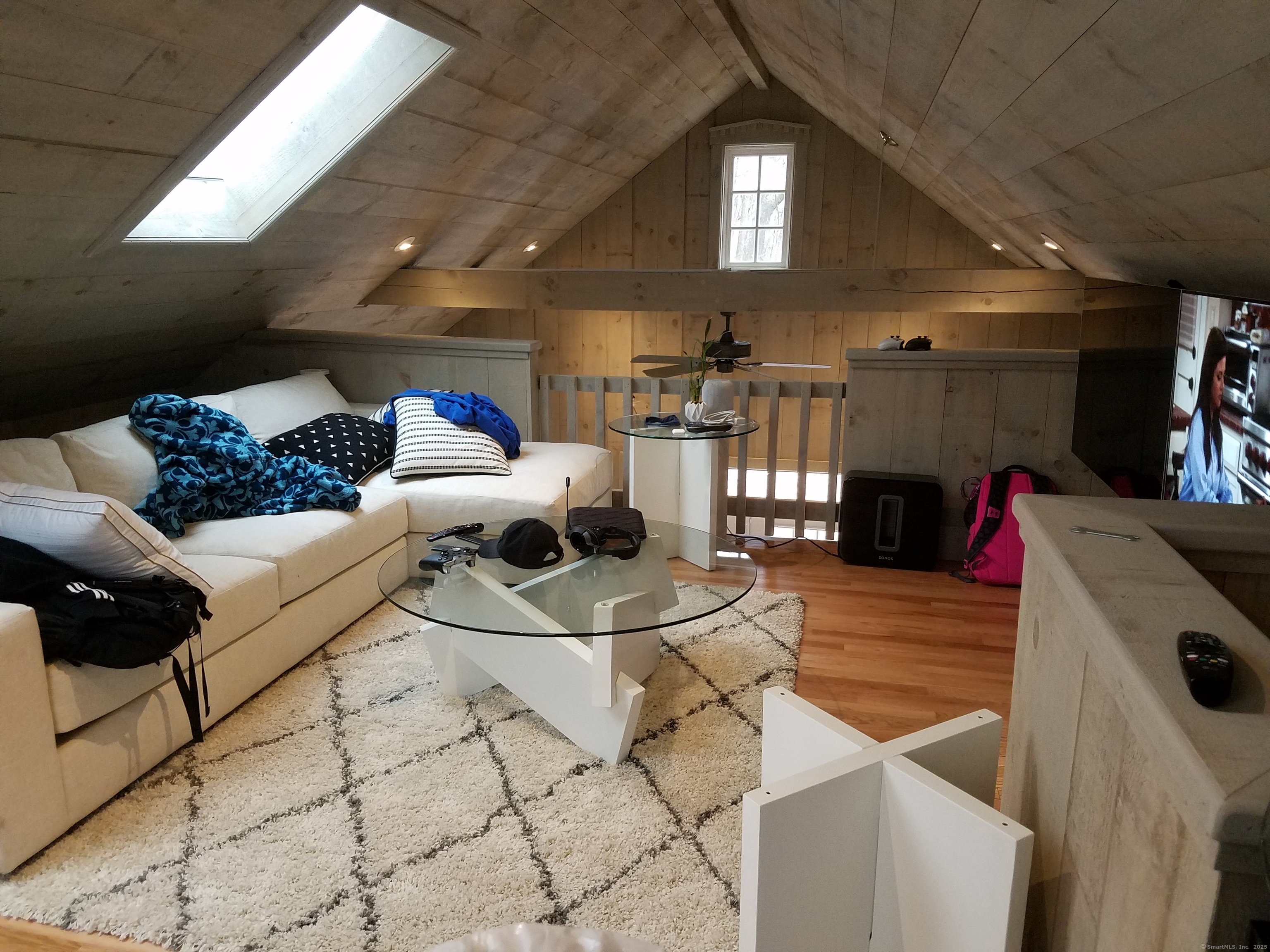 134 Nashville Road Bethel, CT 06801 - Photo 12 of 36 a living room with furniture and a chandelier