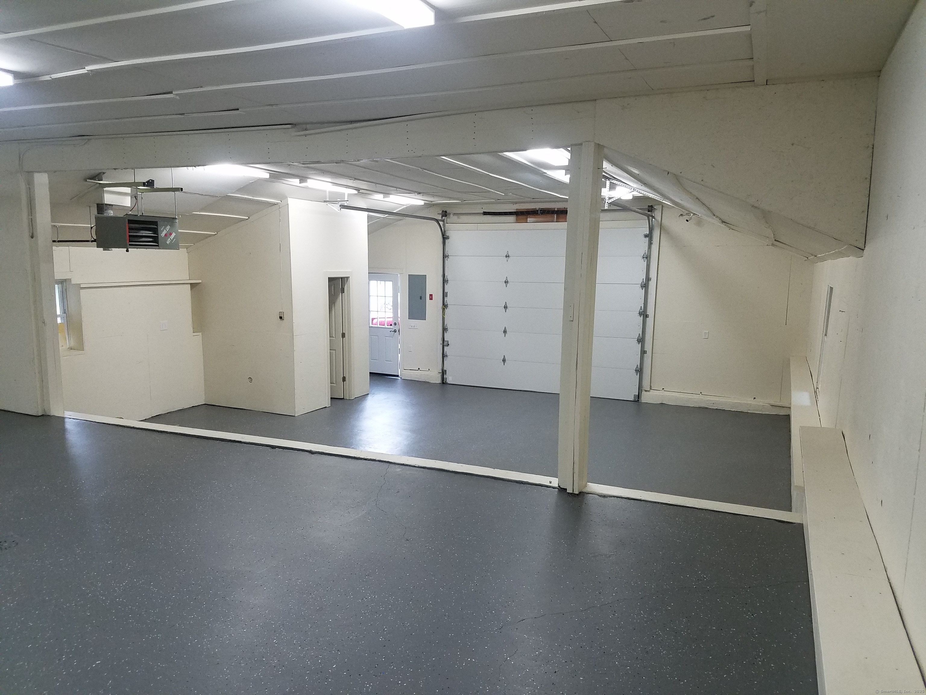 134 Nashville Road Bethel, CT 06801 - Photo 21 of 36 a view of a room with wooden floor and windows