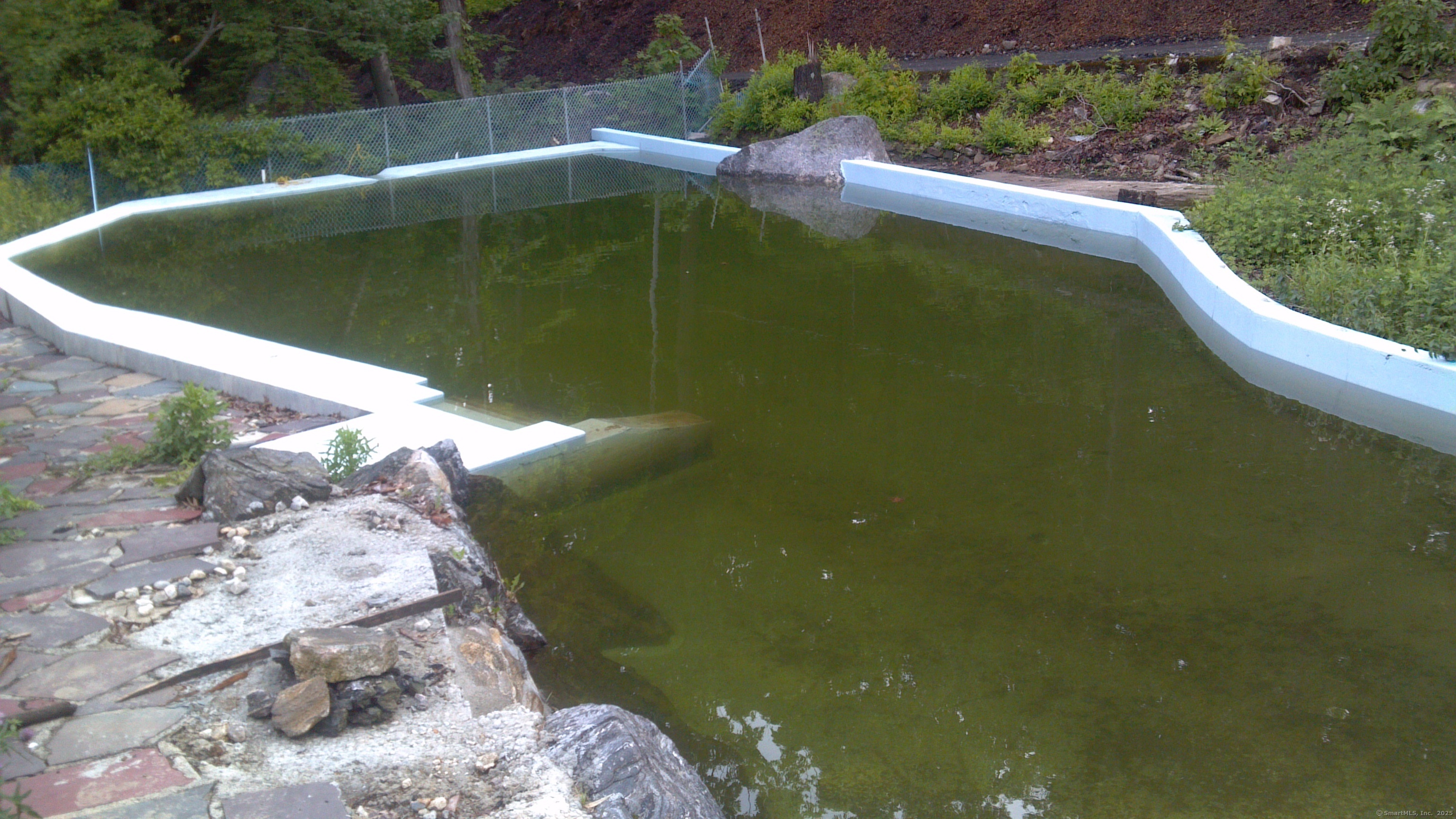 134 Nashville Road Bethel, CT 06801 - Photo 28 of 36 a view of a swimming pool with a yard