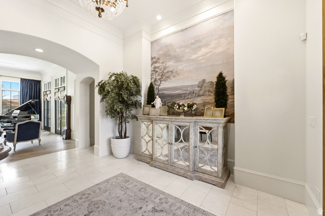 71 Farm Road Midway, UT 84049 - Photo 6 of 92 Grand entryway featuring high ceilings, a decorative chandelier, and light-toned tile flooring
