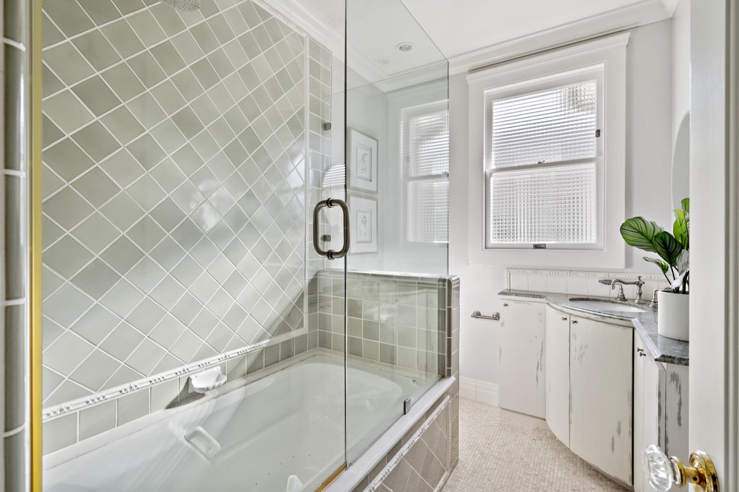 166 Warren Road San Mateo, CA 94401 - Photo 14 of 21 a bathroom with a granite countertop bathtub a shower and a sink