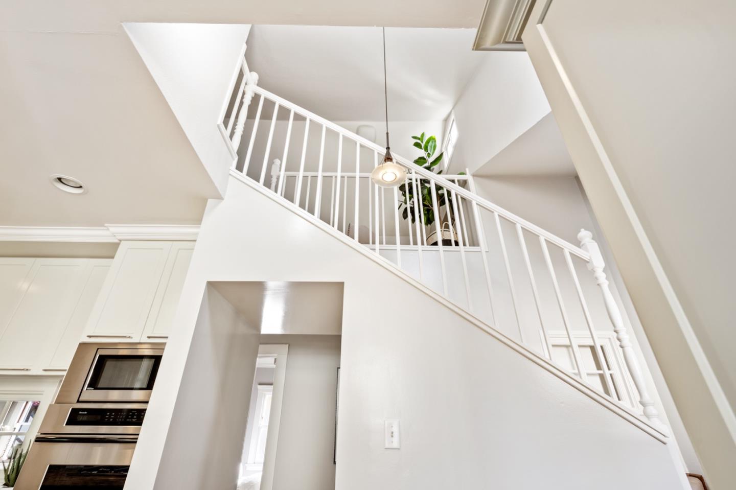 166 Warren Road San Mateo, CA 94401 - Photo 18 of 21 a view of entryway and hall with wooden floor