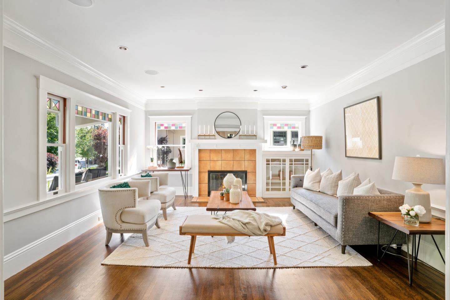 166 Warren Road San Mateo, CA 94401 - Photo 5 of 21 a living room with furniture a fireplace and a table