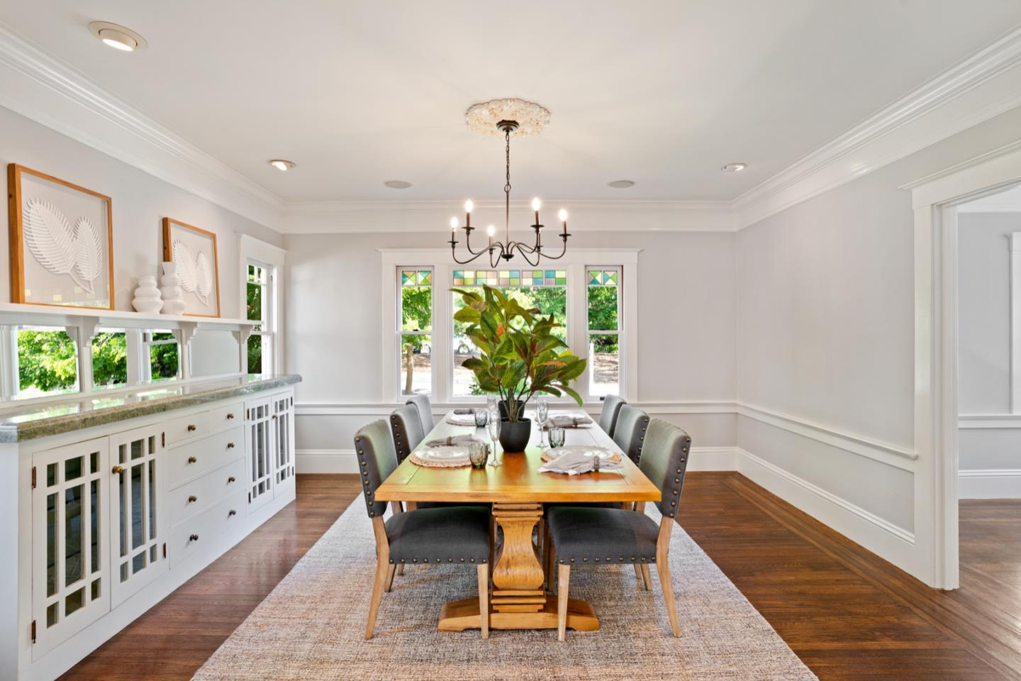 166 Warren Road San Mateo, CA 94401 - Photo 8 of 21 a dining room with furniture a rug and wooden floor