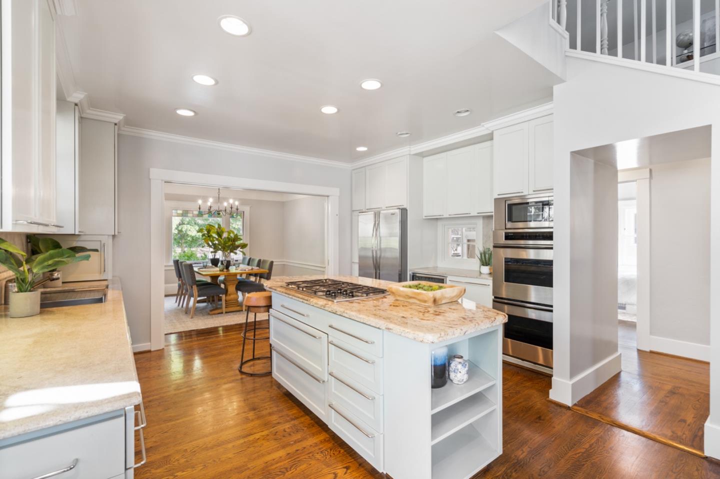 166 Warren Road San Mateo, CA 94401 - Photo 10 of 21 a kitchen that has a lot of cabinets a sink and appliances in it