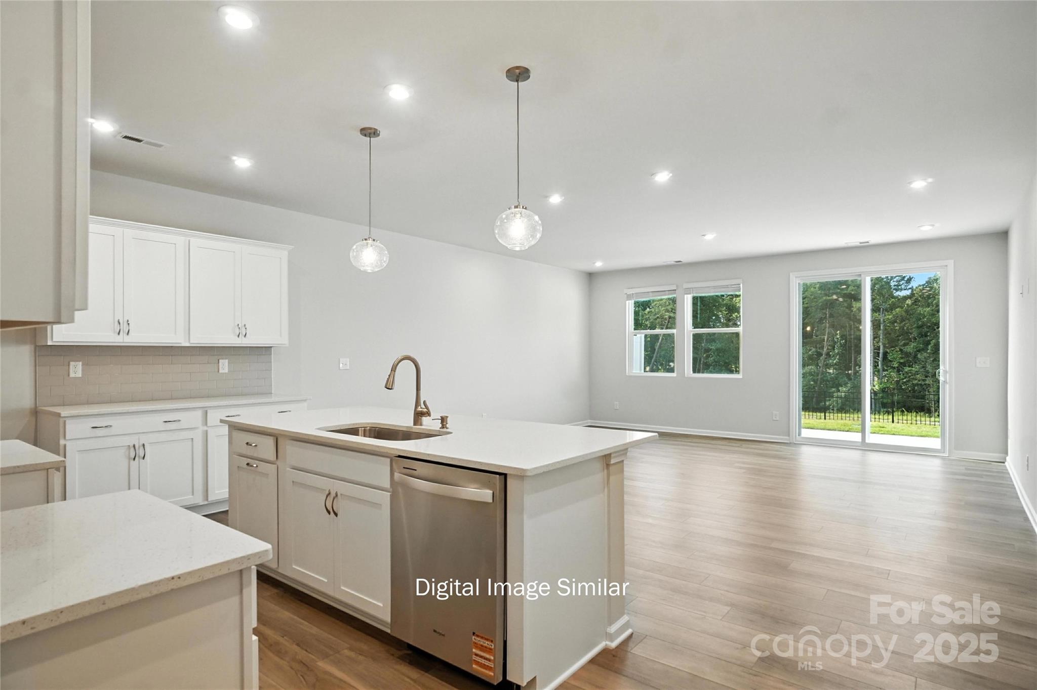 1209 Vibrant Road Charlotte, NC 28215 - Photo 1 of 8 a kitchen with a sink window and cabinets