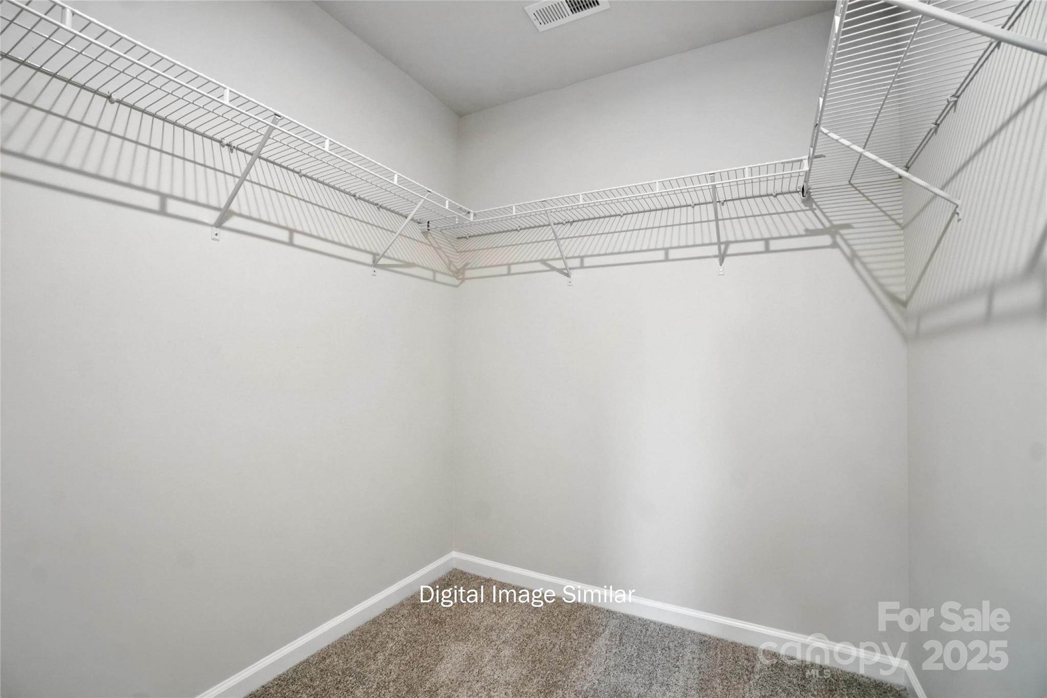 1209 Vibrant Road Charlotte, NC 28215 - Photo 5 of 8 a view of a room with racks on the wall