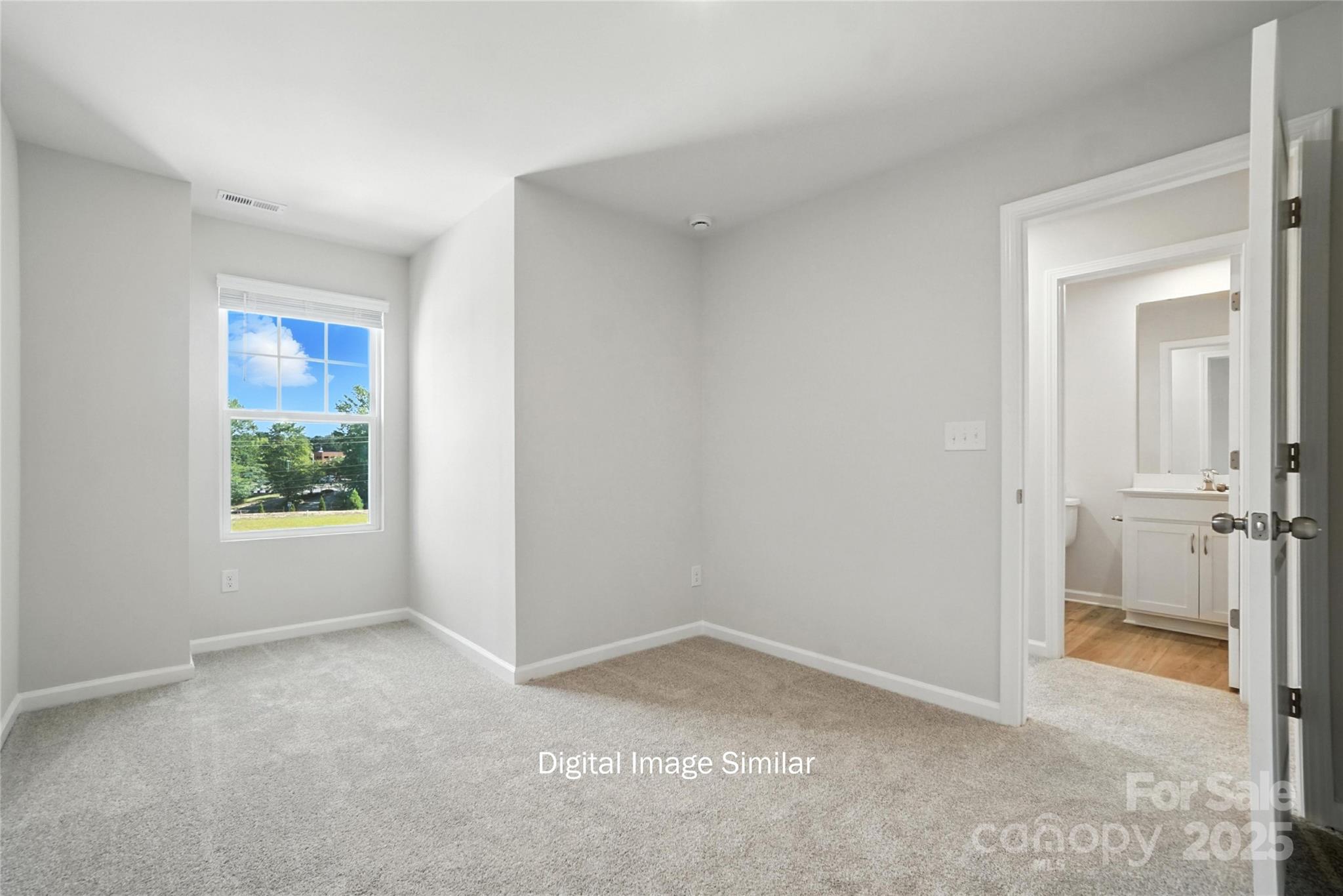 1209 Vibrant Road Charlotte, NC 28215 - Photo 7 of 8 an empty room with windows and closet
