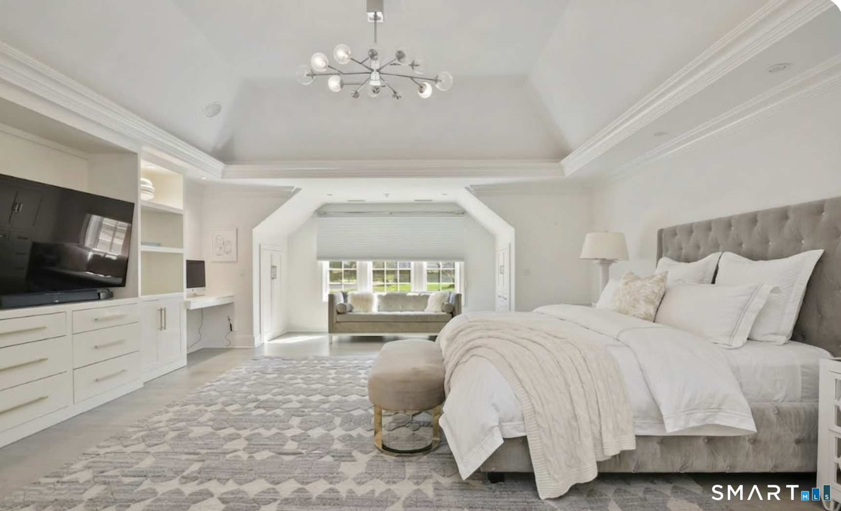 127 Fields Rock Road Fairfield, CT 06890 - Photo 19 of 40 a spacious bedroom with a bed and flat screen tv