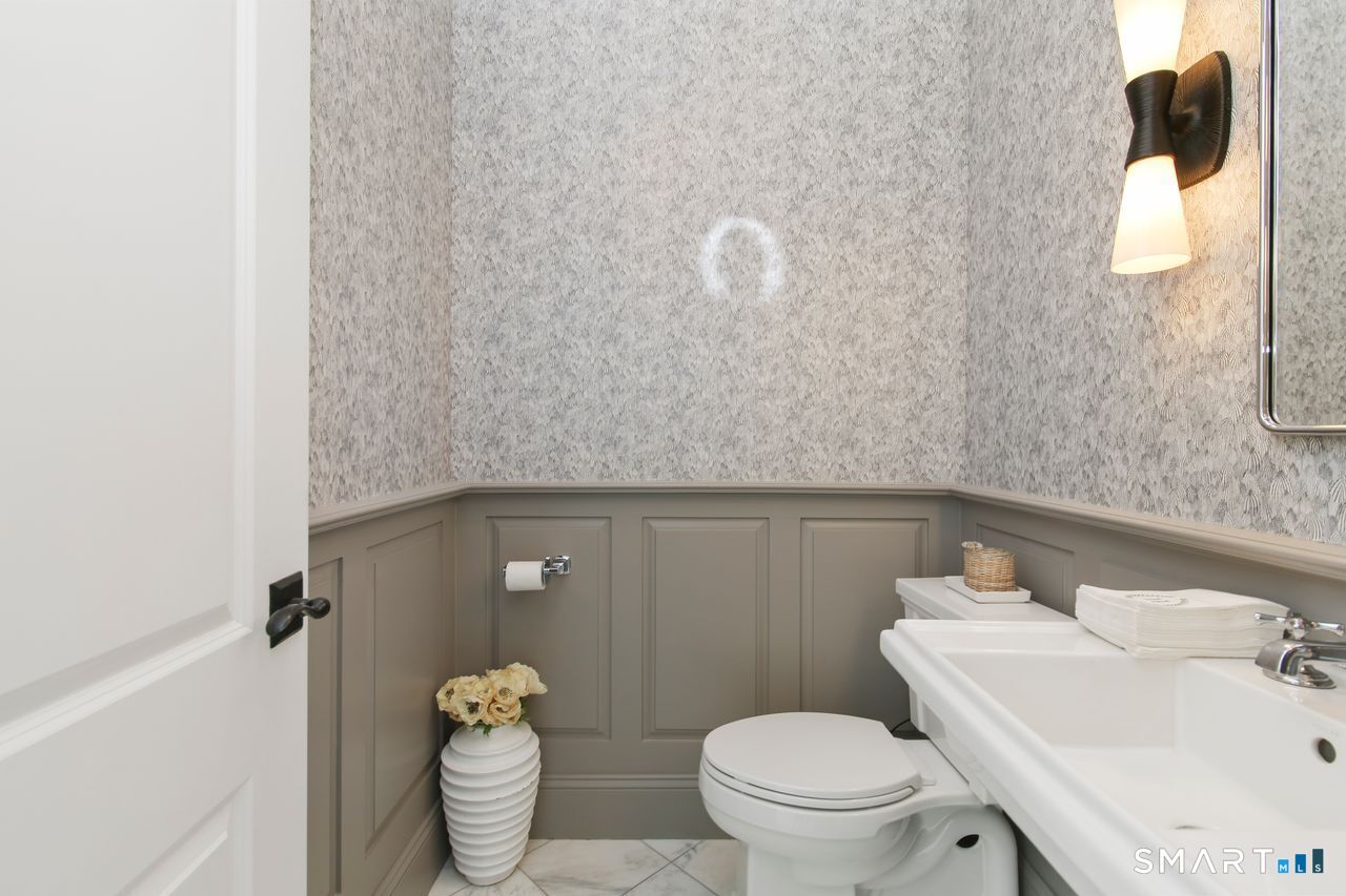 127 Fields Rock Road Fairfield, CT 06890 - Photo 27 of 40 a bathroom with a toilet and a sink