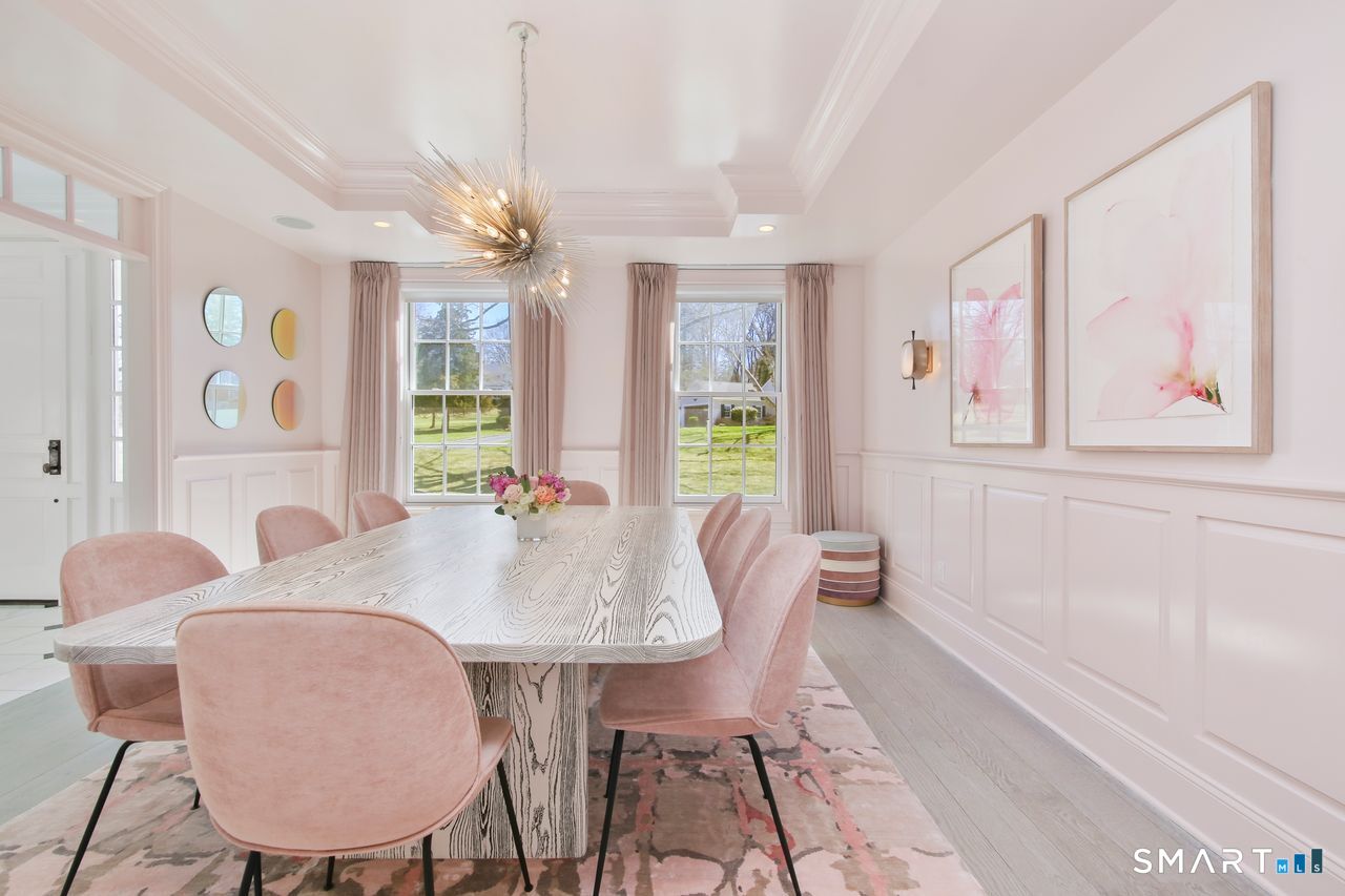 127 Fields Rock Road Fairfield, CT 06890 - Photo 28 of 40 a view of a a dining room with furniture window and wooden floor
