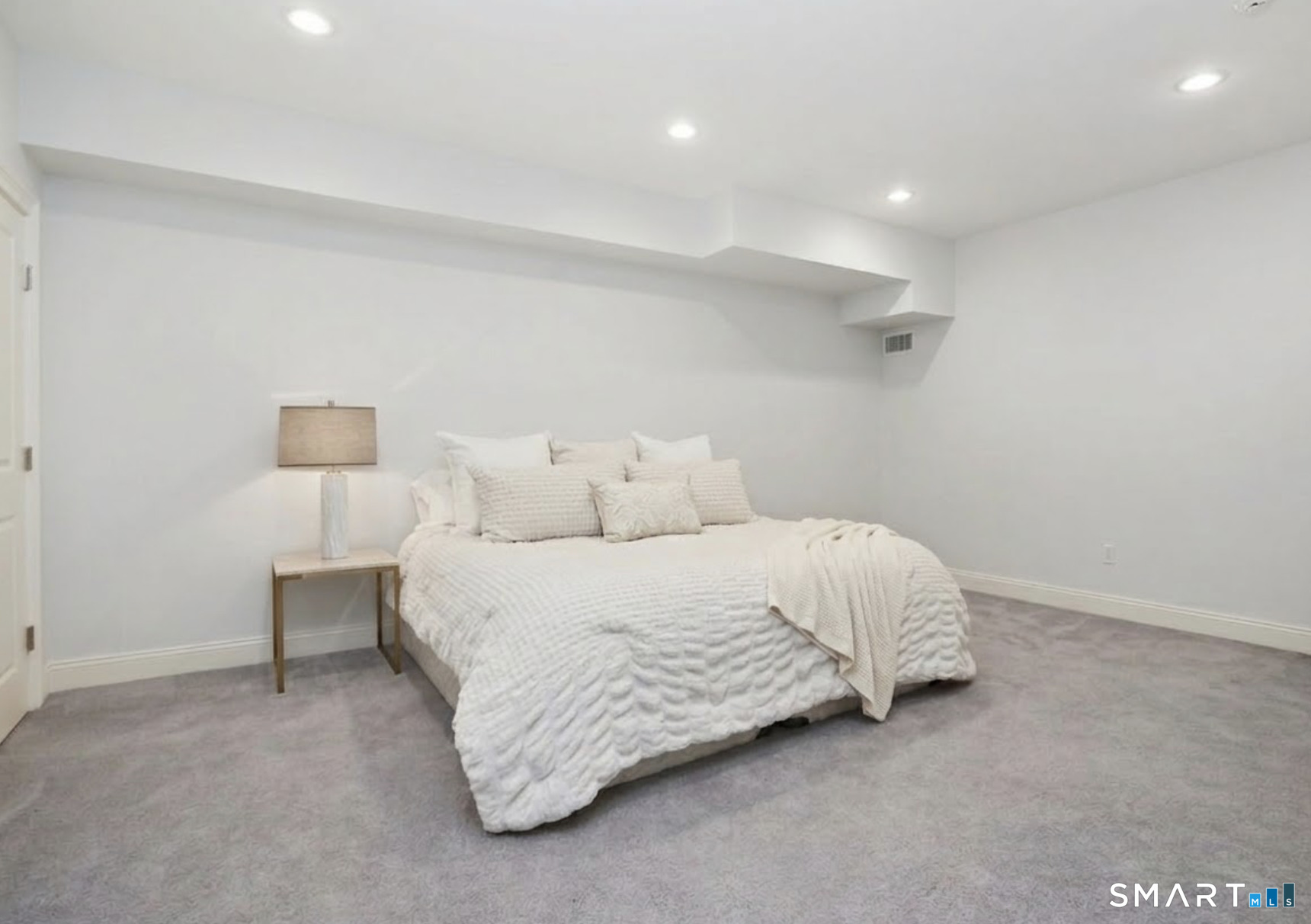 127 Fields Rock Road Fairfield, CT 06890 - Photo 29 of 45 a bed room with a bed and two night stand