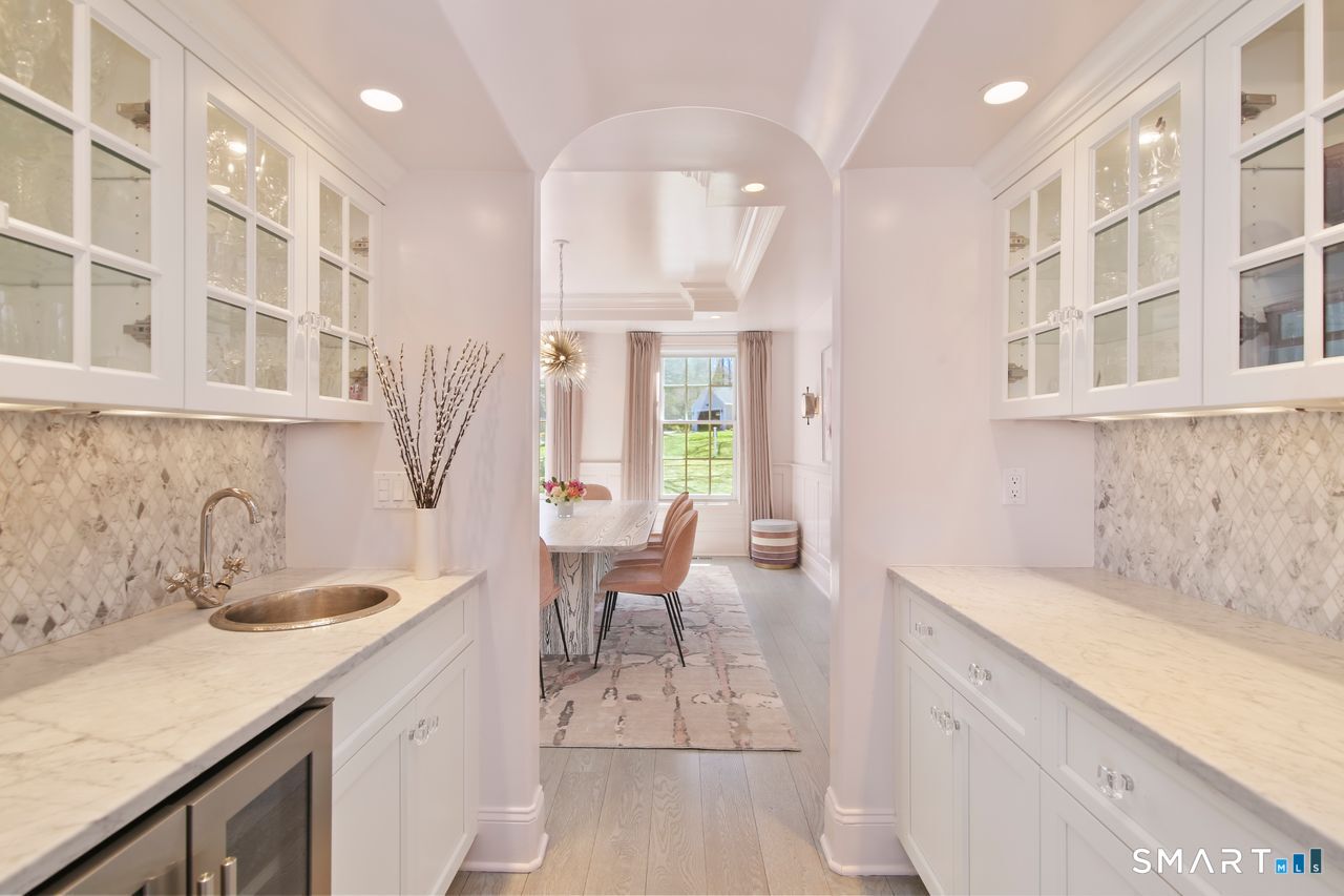 127 Fields Rock Road Fairfield, CT 06890 - Photo 29 of 40 a kitchen with a sink and cabinets