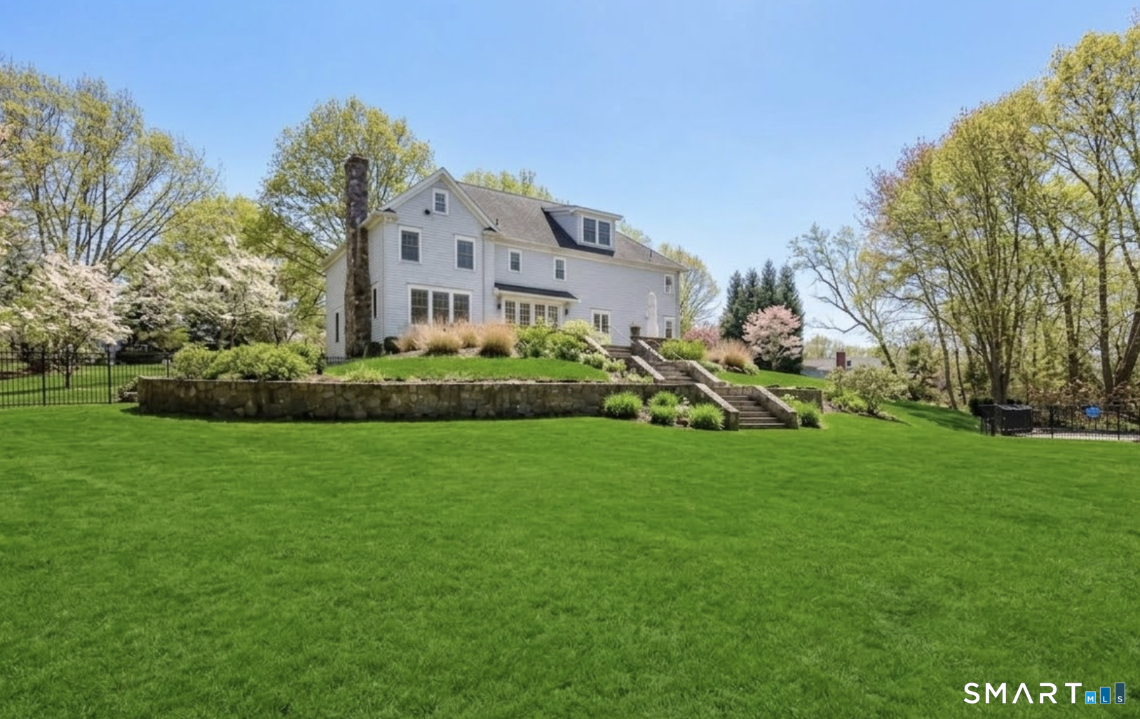 127 Fields Rock Road Fairfield, CT 06890 - Photo 35 of 40 a view of an house with backyard space and garden