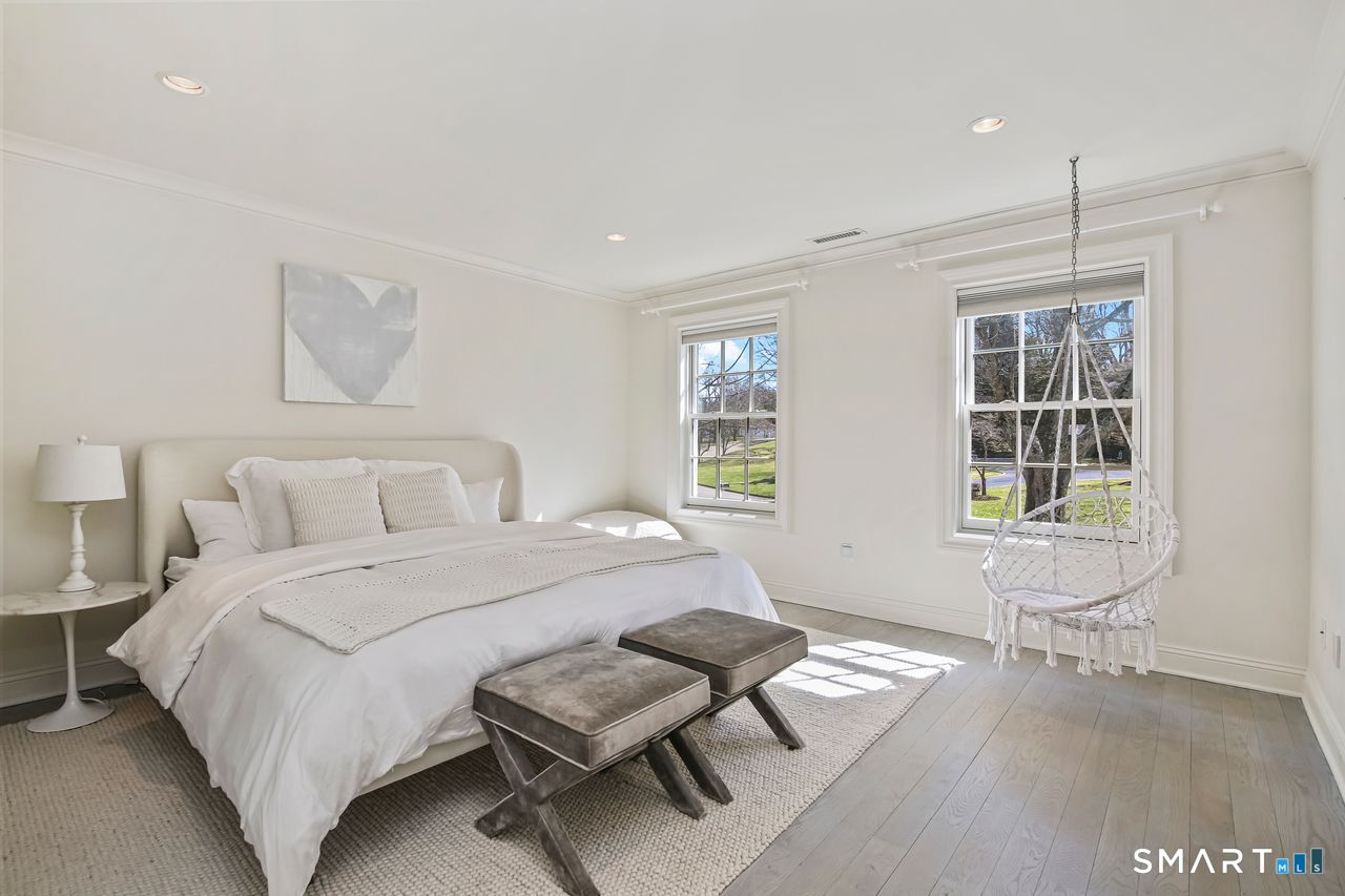 127 Fields Rock Road Fairfield, CT 06890 - Photo 35 of 45 a bedroom with a bed and wooden floor