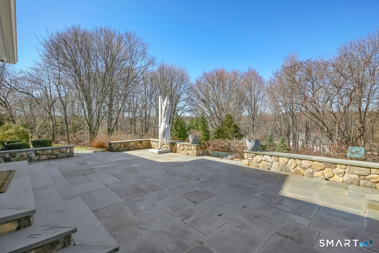 127 Fields Rock Road Fairfield, CT 06890 - Photo 36 of 45 a view of a park with trees and a house