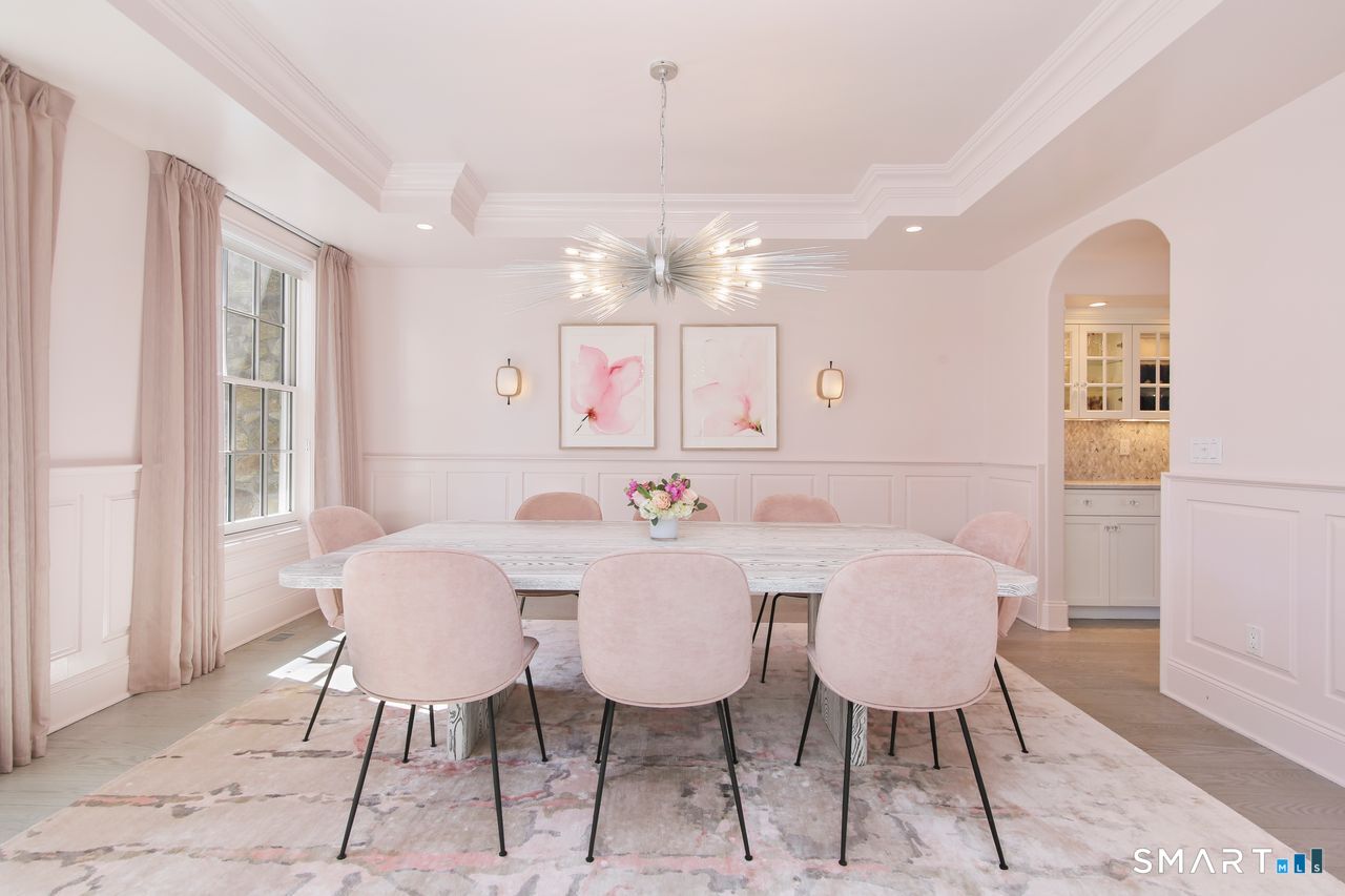 127 Fields Rock Road Fairfield, CT 06890 - Photo 37 of 45 a view of a dining room with furniture and chandelier