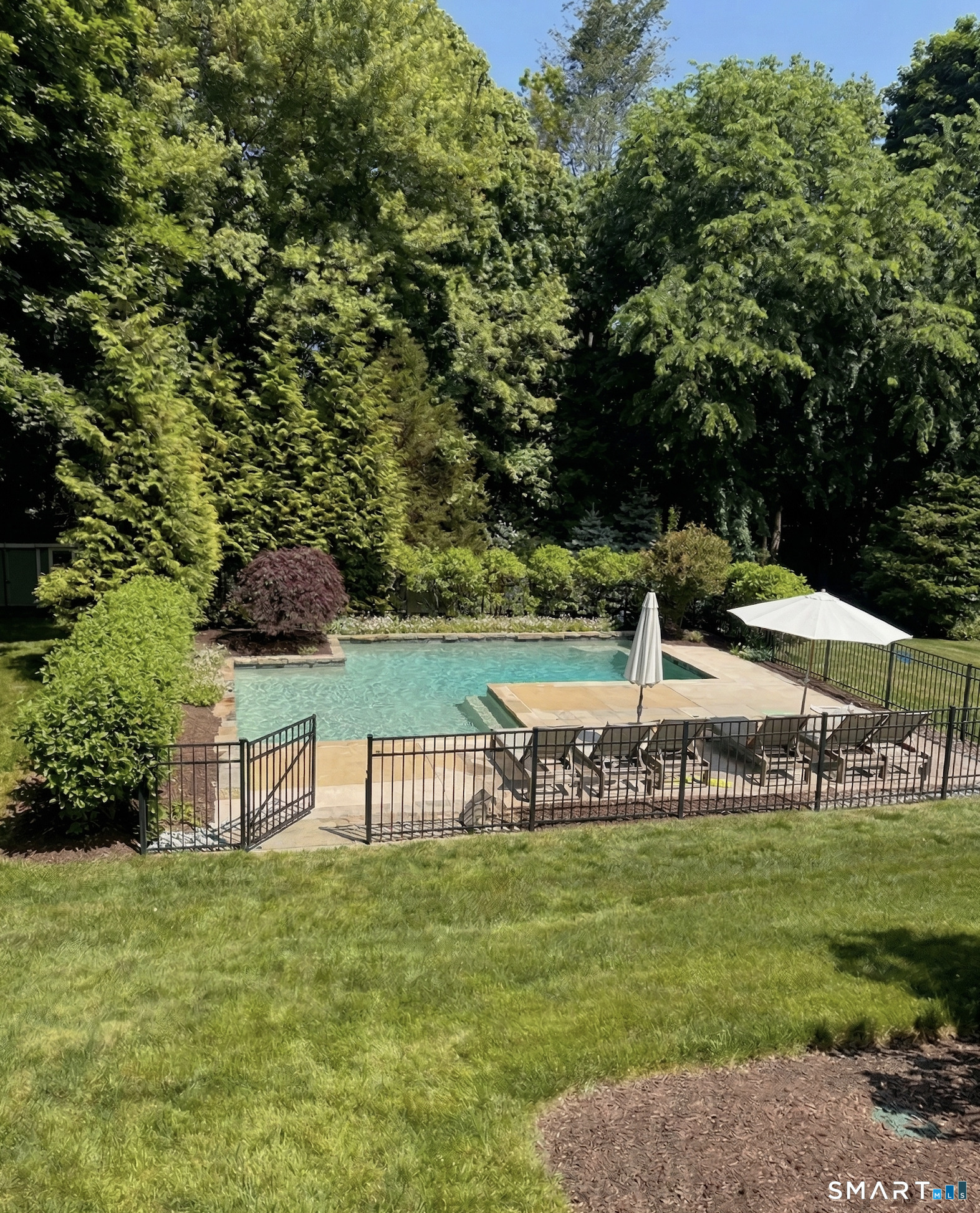 127 Fields Rock Road Fairfield, CT 06890 - Photo 37 of 40 a view of a park with bench and trees