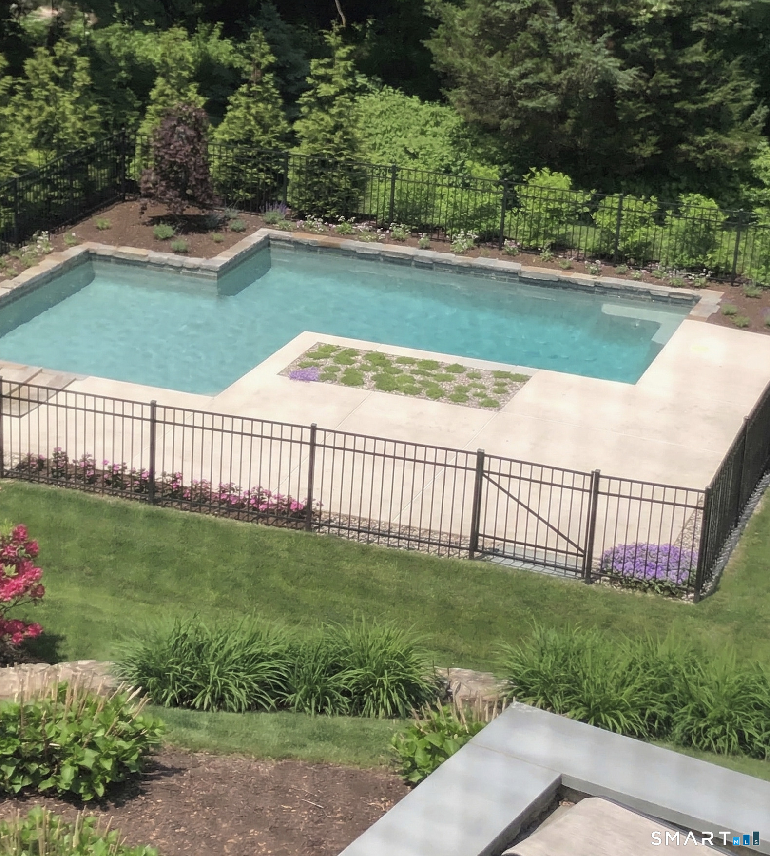 127 Fields Rock Road Fairfield, CT 06890 - Photo 38 of 40 a view of a backyard with a garden