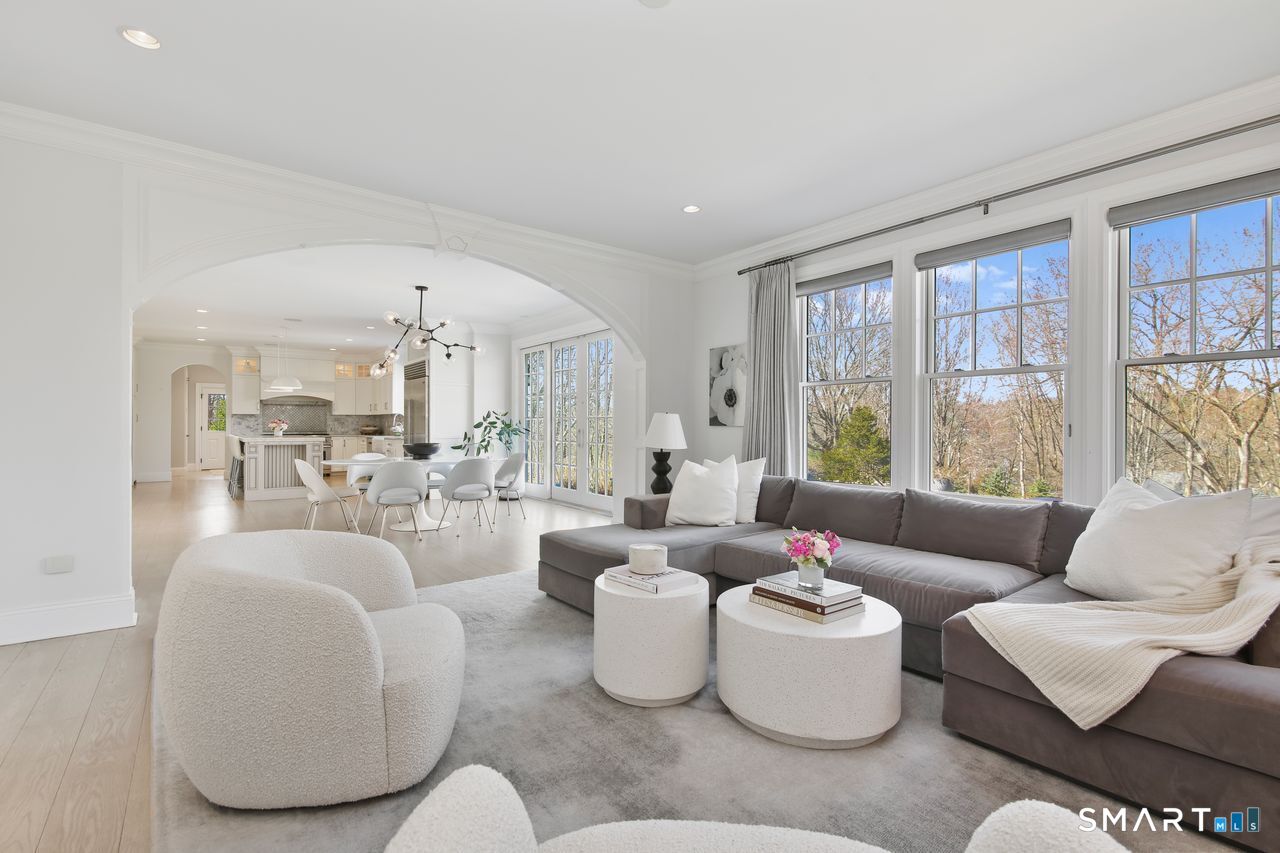 127 Fields Rock Road Fairfield, CT 06890 - Photo 9 of 40 a living room with furniture and a large window