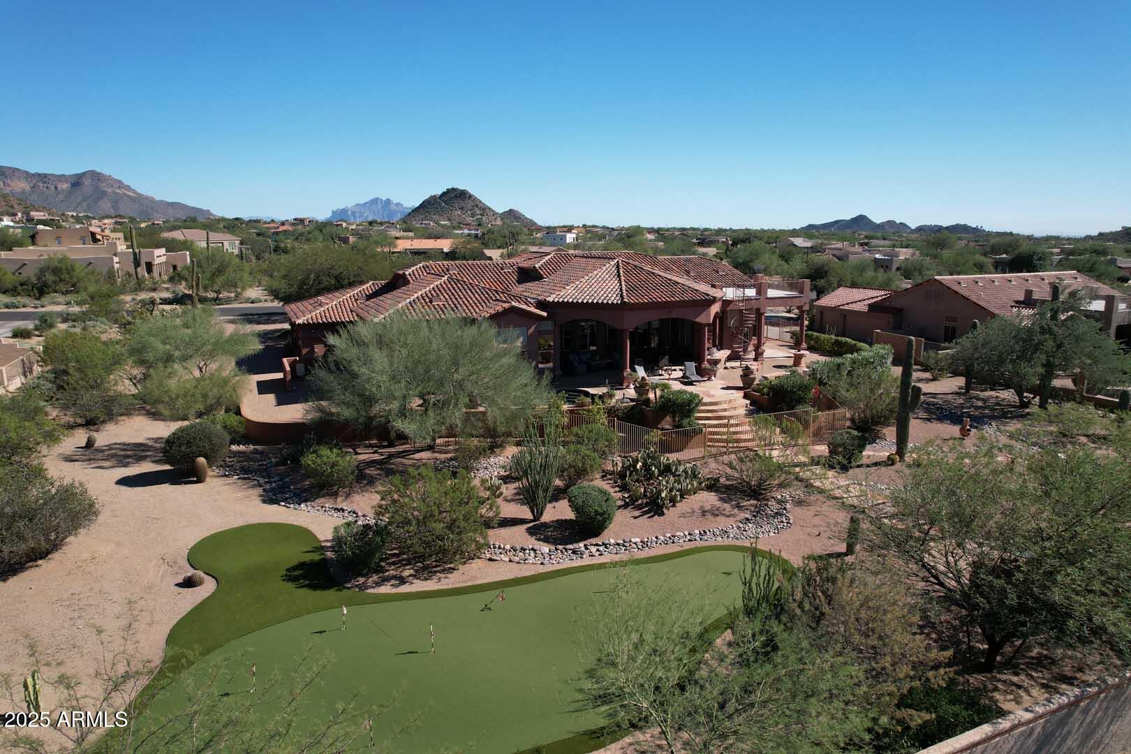 8540 East McDowell Road, Unit 55 Mesa, AZ 85207 - Photo 102 of 111 an aerial view of a house with a garden