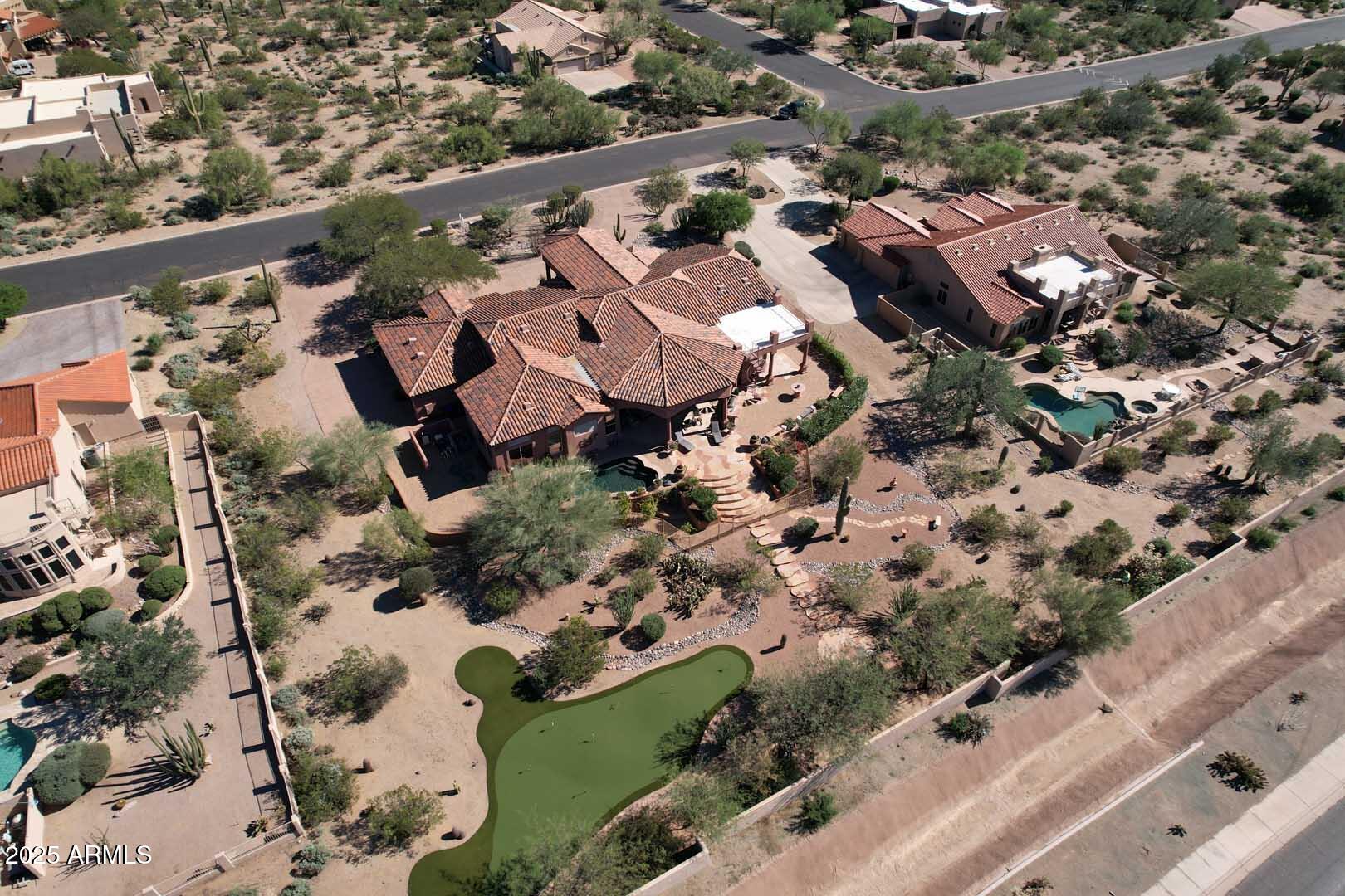 8540 East McDowell Road, Unit 55 Mesa, AZ 85207 - Photo 107 of 111 an aerial view of residential houses with outdoor space