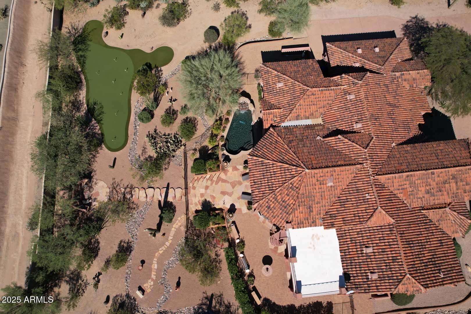 8540 East McDowell Road, Unit 55 Mesa, AZ 85207 - Photo 110 of 111 an aerial view of houses with outdoor space