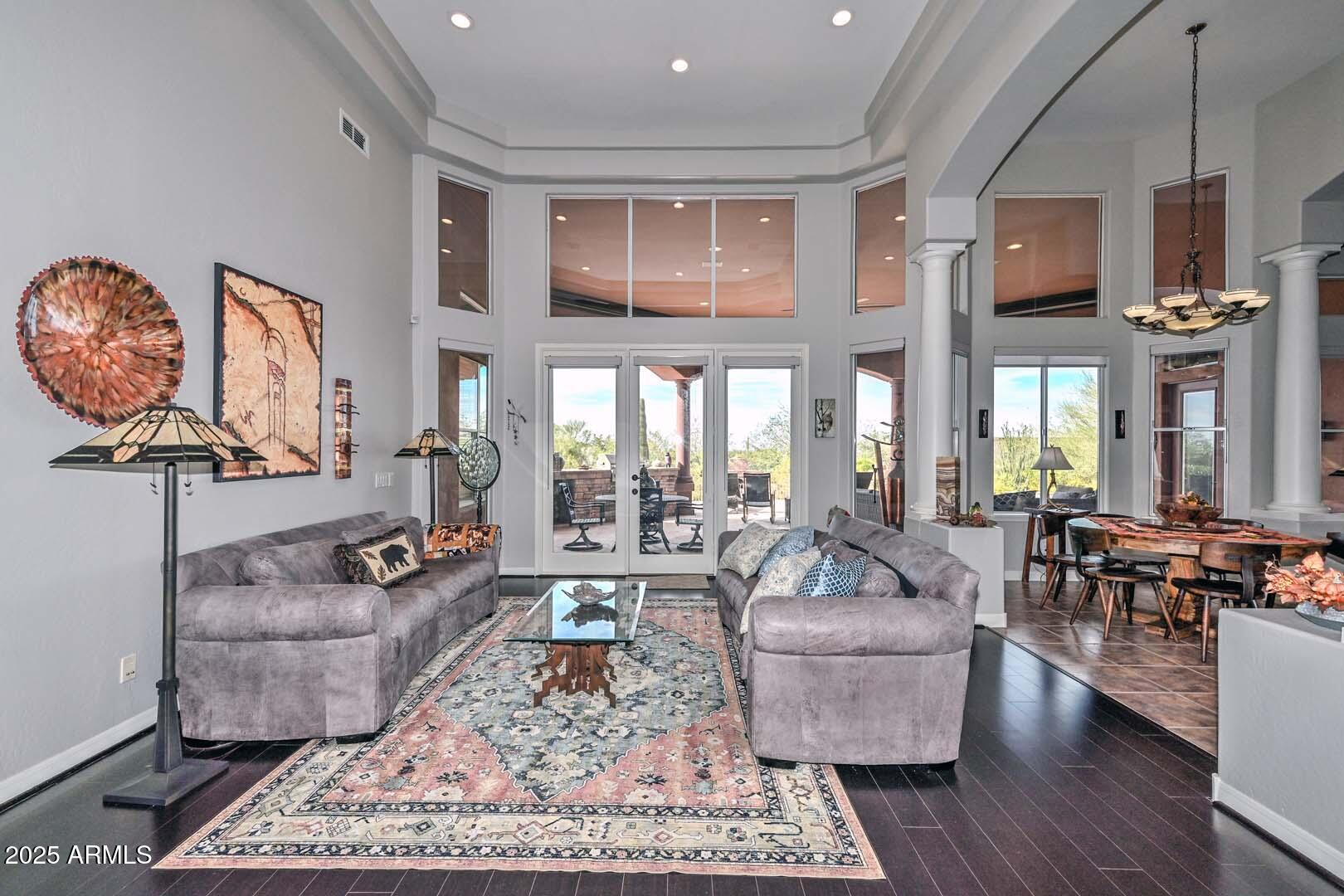 8540 East McDowell Road, Unit 55 Mesa, AZ 85207 - Photo 23 of 111 a living room with furniture and a large window