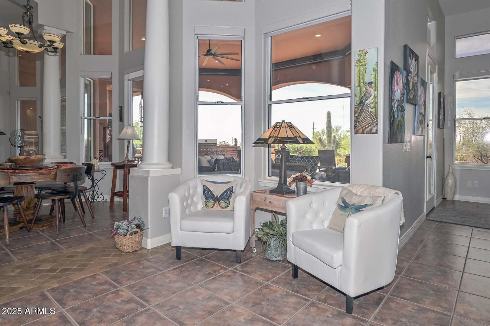 8540 East McDowell Road, Unit 55 Mesa, AZ 85207 - Photo 33 of 111 a living room with fireplace furniture and a large window