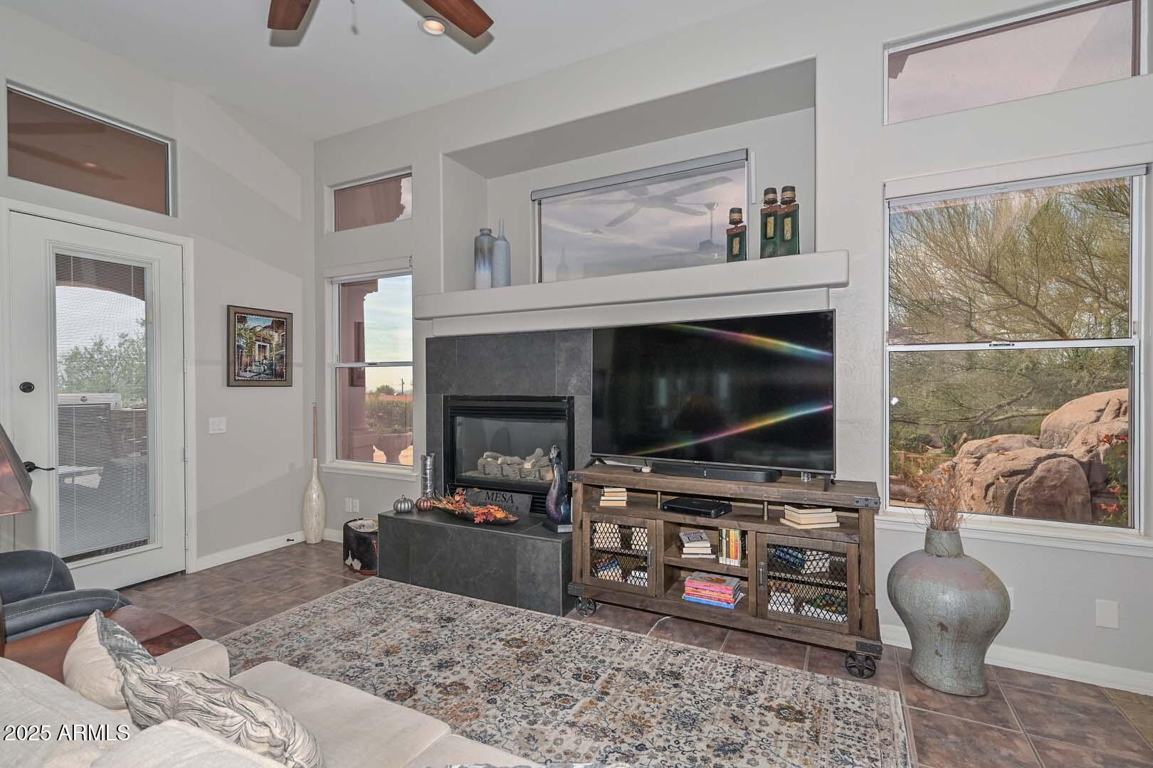8540 East McDowell Road, Unit 55 Mesa, AZ 85207 - Photo 39 of 111 a living room with furniture and a flat screen tv