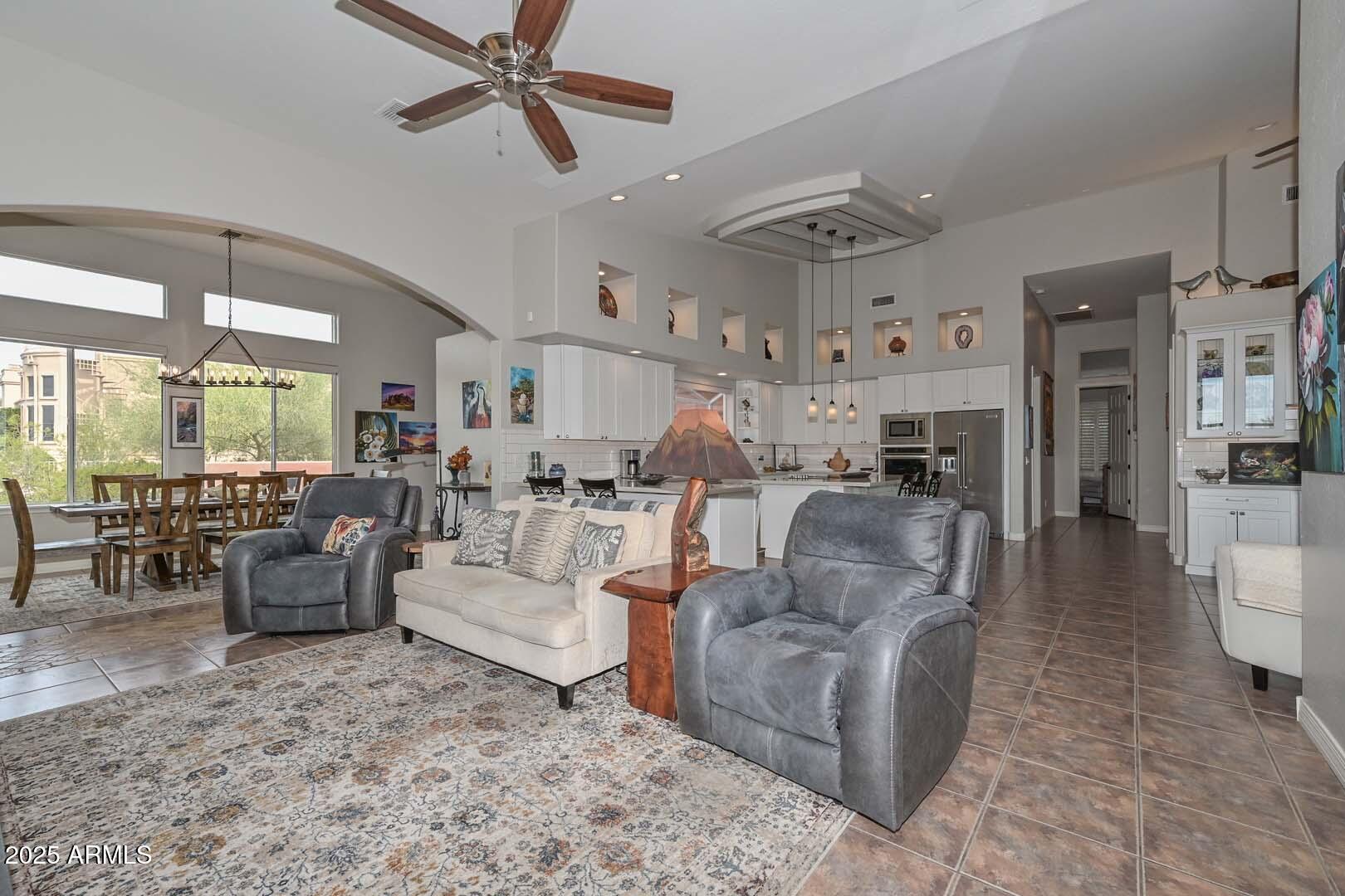 8540 East McDowell Road, Unit 55 Mesa, AZ 85207 - Photo 42 of 111 a living room with furniture kitchen view and a large window