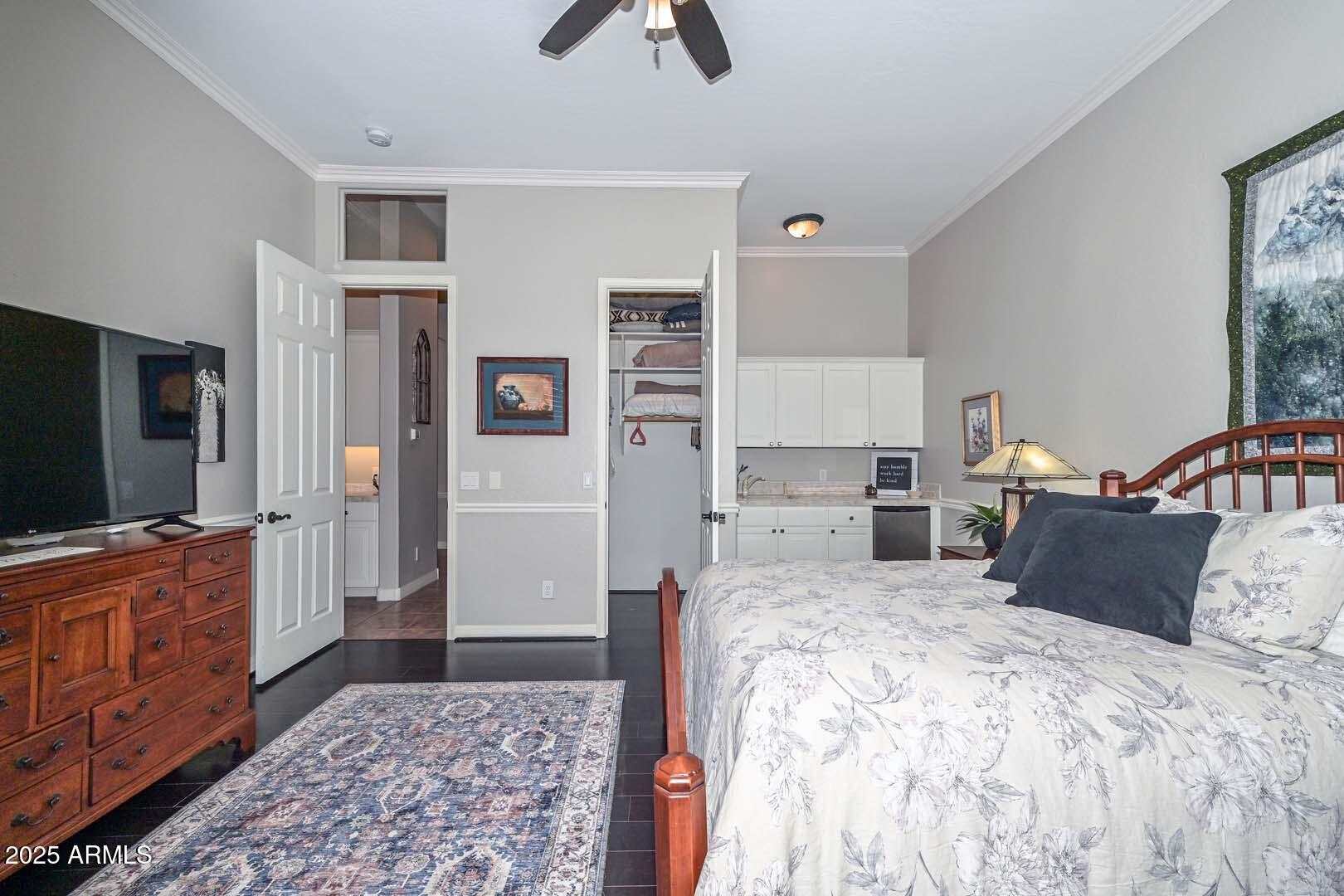 8540 East McDowell Road, Unit 55 Mesa, AZ 85207 - Photo 48 of 111 a bedroom with a bed and flat screen tv