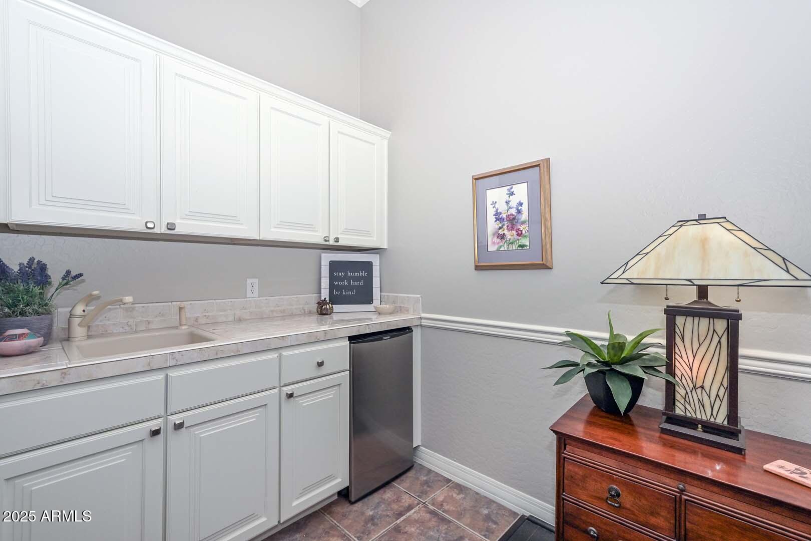 8540 East McDowell Road, Unit 55 Mesa, AZ 85207 - Photo 49 of 111 a kitchen with stainless steel appliances granite countertop a sink a stove and a window