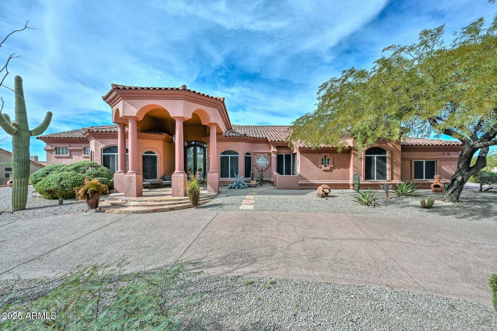 8540 East McDowell Road, Unit 55 Mesa, AZ 85207 - Photo 5 of 111 a view of a house with a patio